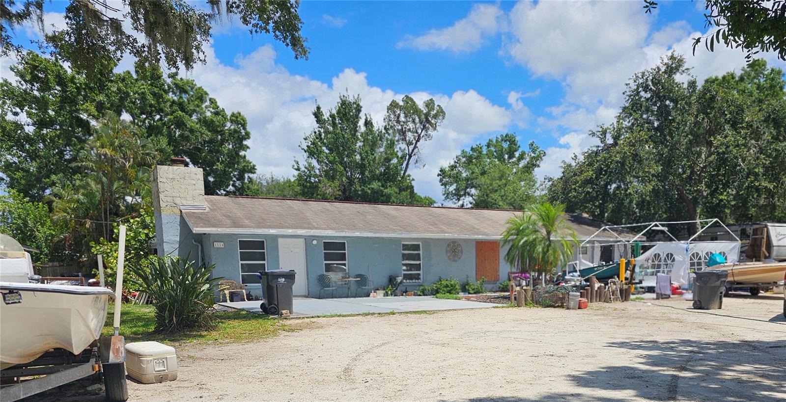 Plenty of room in this wonderful property with in-ground pool. It can be utilized as a duplex or a mother-in-law suite would be a blessing to the right person. This great location is close to Highway 674 and I 75 huge 145‘ x 208‘ corner property ,this easy location is a short walk to bus stop. Some TLC and cleanup will bring this Diamond back to shine again.