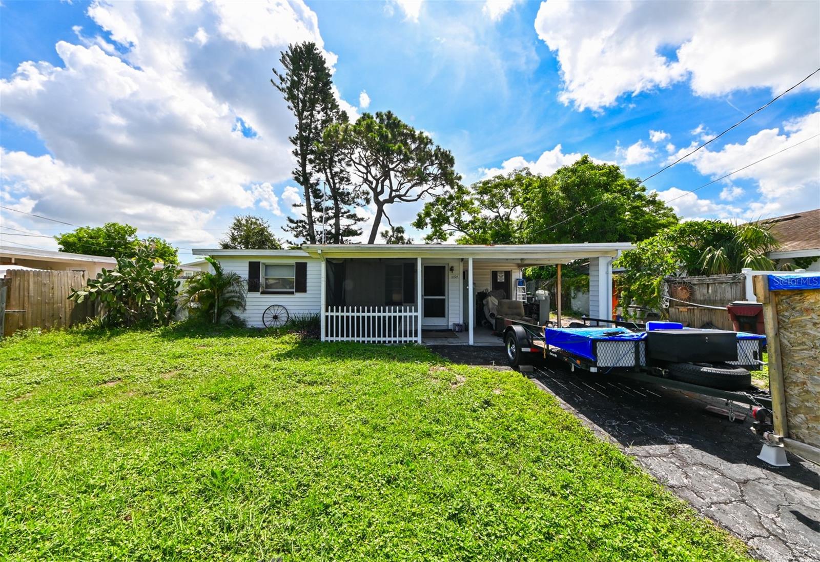 Under contract-accepting backup offers. INVESTOR OPPORTUNITY near IDN Rocks Beach! This 2-bedroom, 1-bath single-family home with a
large bonus room offers a fantastic opportunity for investors or savvy buyers looking to add value.
Tucked away in the quiet Orange Lake Village community, this home features a charming front porch,
an attached carport, and a spacious fenced backyard, perfect for relaxing or entertaining. Located
just 15 minutes from the bright sands of IDN Rocks Beach and minutes away from US-19, you’ll
enjoy the best of Florida living with convenient access to shopping, dining, and coastal
attractions. With its quiet and peaceful neighborhood charm and versatile layout, this home is
ready for your vision. Call now and schedule your showing today!