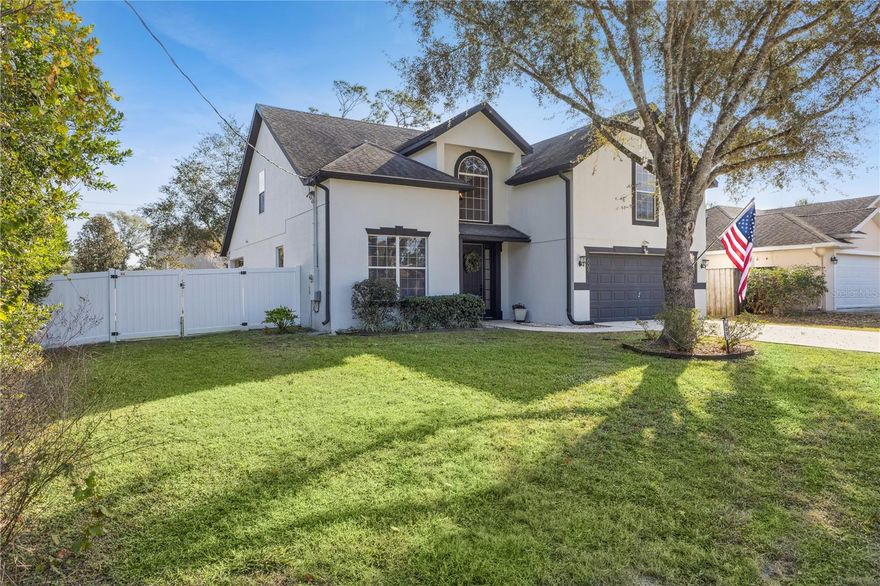 Move-In Ready! NO HOA! Spacious home in WESTWOOD HEIGHTS. This four-bedroom, two and a half bath, two-car garage home features a large fully FENCED-IN backyard. Updates: Exterior Painted (2025), Vinyl Fence (2025), Luxury Vinyl Flooring on First Floor (2024), Interior Paint (2024), Kitchen Refresh (2023), Primary Bathroom/Half a Bath refresh (2023), Water Heater (2024), and AC (2017). The Kitchen has an abundance of counter space, featuring an island, breakfast bar, and a Walk-In Pantry. The family room is open to the kitchen and Dining Room perfect for entertaining. The PRIMARY SUITE AND PRIMARY ENSUITE BATH located on the First Floor with an inviting large GARDEN SOAKING TUB, DOUBLE VANITY, separate SHOWER, and WALK-IN CLOSET with access to the covered lanai. Secondary bedrooms are generously sized including one oversized room ideal for a flex space or for guests, all bedrooms are serviced by the secondary guest bathroom.  Indoor laundry room. The spacious backyard is great for outdoor grilling and overlooks the beautiful fully fenced-in yard. Just 3 miles away from the historic downtown Deland, where you can enjoy food, shopping and fun. Daytona, New Smyrna and Ormond Beach – all within a 40-minute drive. St. John’s Marina in Deland is a local haven for outdoor fun with boat access and a large RV campground. Stetson University, a nationally ranked college, is in Central Deland. Local restaurants to enjoy, The Table Restaurant, Half Wall Deland, Cress Restaurant, the Deland Stockyard or The Parched Oak!