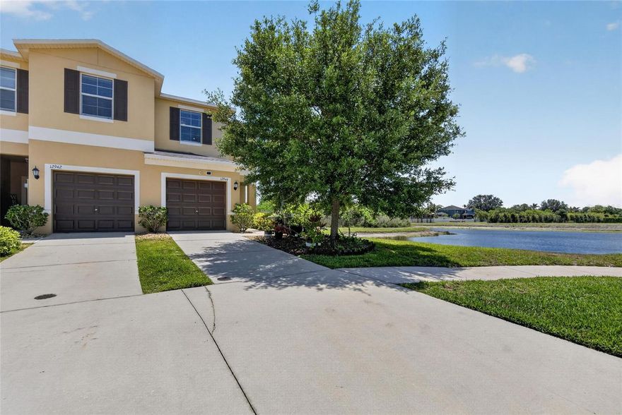 Welcome to this beautifully maintained 2-bedroom, 2.5-bath townhome located in the desirable Summerfield Crossings community of Riverview. Built in 2017, this home offers an open-concept floor plan designed for comfortable living and easy entertaining. The kitchen features ample cabinet and counter space, new stainless-steel appliances, including an upgraded induction range and overlooks the bright and inviting living area. Upstairs, you’ll find upgraded laminate flooring throughout, including the staircase with stylish laminate stair treads—completely eliminating carpet from the home for a clean, modern feel. Both bedrooms are generously sized, including a spacious primary suite and a second bedroom with its own private ensuite bathroom, making it ideal for guests, multi-generational living, or a private home office setup. A versatile loft area adds additional living or workspace flexibility. Enjoy relaxing mornings or evenings from the screened lanai overlooking peaceful pond views. Additional features include an upstairs laundry room, attached one-car garage, and abundant natural light throughout. Residents enjoy access to community amenities including a pool, fitness center, tennis and basketball courts, dog park, playgrounds, and walking trails. Conveniently located near shopping, dining, I-75, and the Crosstown Expressway for an easy commute to Tampa and surrounding areas.
