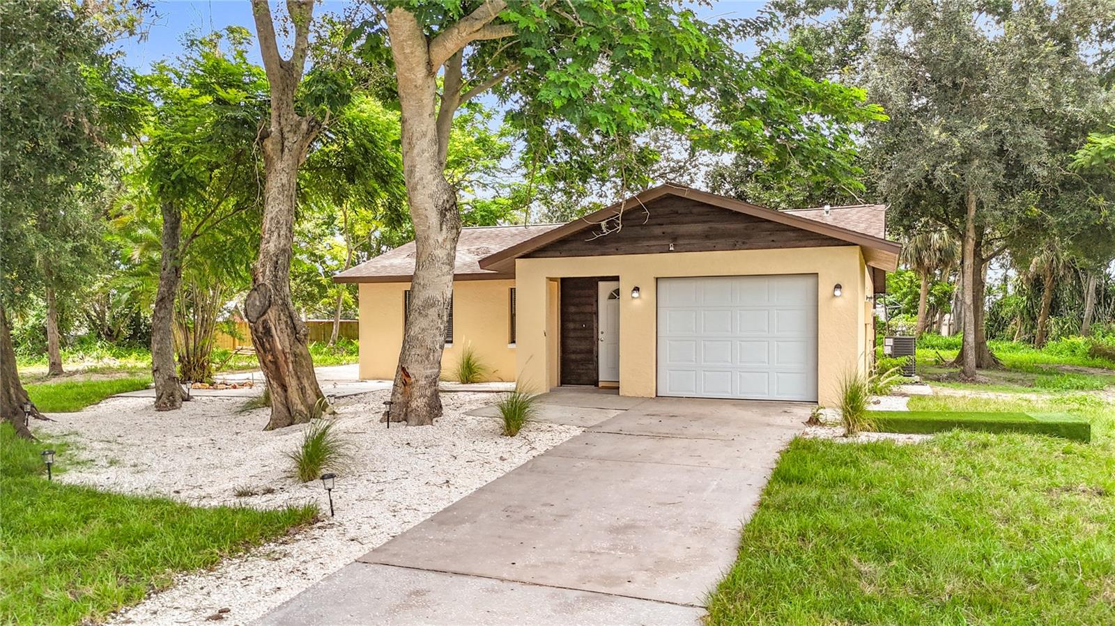 FULLY REHABED!!! Exceptional investment opportunity; This stunning two-bedroom two-bathroom residence, situated on approximately 0.4 acres in central Sarasota. Presents a rare for an expansion at an affordable price under. The property boasts ample space for vehicles and outdoor equipment, paired with a beautifully renovated interior featuring a sleek, modern kitchen and serene bedrooms, a well decorated and designed bathroom and 340 sqft back porch, and an insulated one car garage. NO HOA NO FLOOD ZONE. The adjacent lot zoned RSF2 0.27 acre 11,4858 sqft. The development potential significant, allowing for the construction of a new dwelling or ADU with separate lot number. Strategically located in a prime Sarasota neighborhood, access to nearby amenities and Florida’s most attractive destinations is effortless. Whether envisioning a workshop or expansive space for adventure, 5137 Camus way offers unparalleled freedom and opportunities. Schedule a tour today to capitalize on this extraordinary lifestyle. NOTE: House and smaller lot can be purchased for $395,000 with the seperate lot for $90,000.