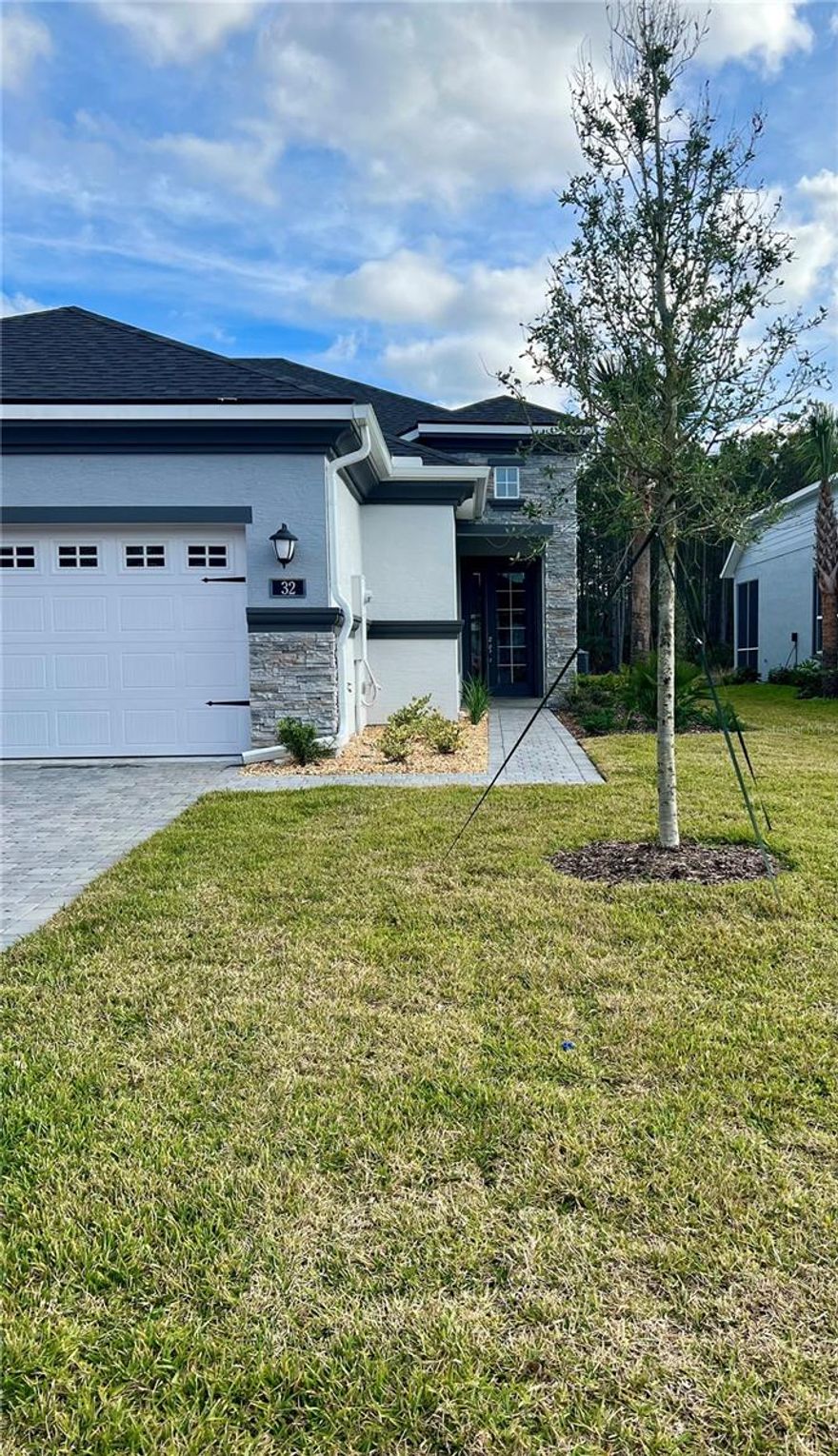 This beautiful Arbor II Model Townhome built in 2022 is located in the sought-after Plantation Bay Gated Golf Community. This townhome offers 2 bedrooms, 2 bathrooms, plus a dedicated office/den, providing flexible living space. The kitchen features stainless steel appliances and beautiful tile backsplash behind the cabinets, creating a clean, modern look. The spacious primary suite includes two oversized walk-in closets and a well-appointed en-suite bath with a walk-in shower. Enjoy Florida living on the screened-in Lanai overlooking a tranquil pond, perfect for relaxing or entertaining this home combines modern design comfort, and low-maintenance living in a premier golf community. Several packages to choose from include 45 holes of golf, tennis, pickle ball, 2 pools, cabana, spa/fitness center and the New Clubhouse! Buyers of this home will receive a substantial discount on the initiation fees when you join within 30 days of closing.