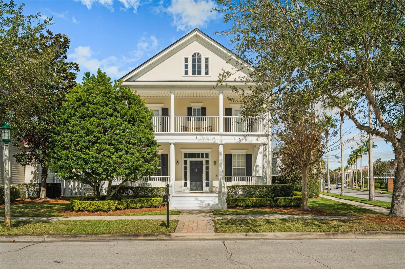 Welcome to Overlook, a beautiful home located on an expansive corner lot across from the East Village pool and playground. This stunning property features double porches, four spacious bedrooms, three and a half bathrooms, and a homesite that spans over one quarter of an acre. As you enter the home, you will be greeted by a grand foyer, dining room, and office space. The two-story family room is complete with a cozy wood-burning fireplace and provides plenty of space for relaxing and entertaining. The large kitchen boasts stainless steel appliances, granite countertops, a center island with seating, and a breakfast area. The first-floor owners suite is located at the rear of the home and offers a comfortable space with views of the spacious fenced-in backyard. The owners suite bathroom features double sinks, a stand-up shower, a tub, and a large walk-in closet. Upstairs, you'll find a bonus loft space that overlooks the family room. Two bedrooms are located at the front of the home and share a Jack and Jill bathroom. Both of these bedrooms have access to the second-story porch, which provides wonderful views of the East Village amenity area. The fourth bedroom is located off of the bonus loft space and is a full suite. The backyard is truly fantastic for gardening, games, pets, and any other outdoor activities you can think of. Overlooking the backyard is a wonderful covered screened-in lanai complete with a tile floor, ceiling fans, and premium ceiling material. There is also a three-car garage that is air-conditioned, and one of the bays has been converted into a workshop. The majority of the interior of the home has just been repainted, and the roof was replaced in 2021. The homes location makes walking or biking to downtown Celebration a breeze, where you can take advantage of all the shopping, restaurants, and events that downtown Celebration provides.This home is an incredible opportunity to live in a beautiful property that offers both comfort and convenience. Schedule your private showing of this fantastic home today.
