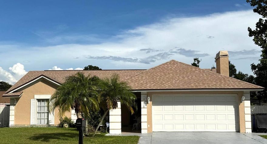 Charming and very comfortable home in the desirable community of Plantation of Carrollwood. Home features 3 bedrooms / 2 full bathrooms and a versatile Den that can serve as a home office or 4th bedroom.  Enjoy the convenience of a 2-car garage equipped with an automatic garage door opener.  Home has a spacious layout with a large living room, a separate dining area, and a cozy family room with vaulted ceiling and fireplace located adjacent to the kitchen.  Kitchen features a breakfast bar and comes with all appliances.  Oversized bonus room provides flexible space ideal for a game room, media room, or additional living area.  Fully fenced backyard.  Home has a newer roof (2023).  A/C Air-Handler (2023). Water Heater (2025).  Blinds on all windows. Low HOA fee. The Plantation Community offers exceptional amenities such as— clubhouse, parks, walking trails, playgrounds, and 2 swimming pools for residents only.  Courts for baseball, soccer, basketball, tennis, racquetball, handball, and volleyball.  Conveniently located near the Suncoast Parkway, major roadways, Citrus Park Mall, shopping centers, restaurants, schools, and medical facilities.  This home combines comfort and convenience.