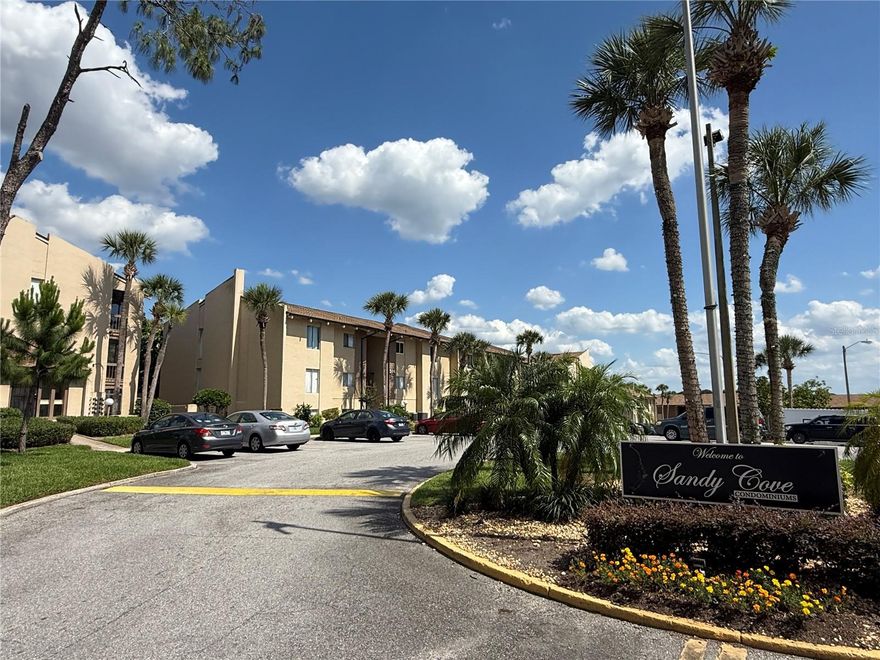 3rd floor unit overlooking a beautifully landscaped garden area with pool & partial view of Lake Orienta in Sandy Cove Condos. Home features modern paint & wood laminate flooring in all main living areas. Interior layout includes a light & bright living/dining room w/huge walk-in closet (it's 53x58-perfect for a "cloffice"!) and large sliding glass doors that open to the screened patio, separate kitchen w/breakfast bar, all appliances & nice closet pantry, full jack-n-jill bathroom w/shower/tub combo, and a spacious bedroom w/another huge walk-in dressing closet! Community offers terrific laundry room, tennis courts, multiple swimming pools, pier, grill/picnic areas and gazebos, volleyball court, parking for boat/jet ski trailers, clubhouse that can be reserved for gatherings & a beautiful lake view from almost everywhere. Unit is walking distance to Florida Hospital, Publix, the mall, Crane's Roost Park & TONS of other everyday amenities & entertainment! EQUAL HOUSING OPPORTUNITY.