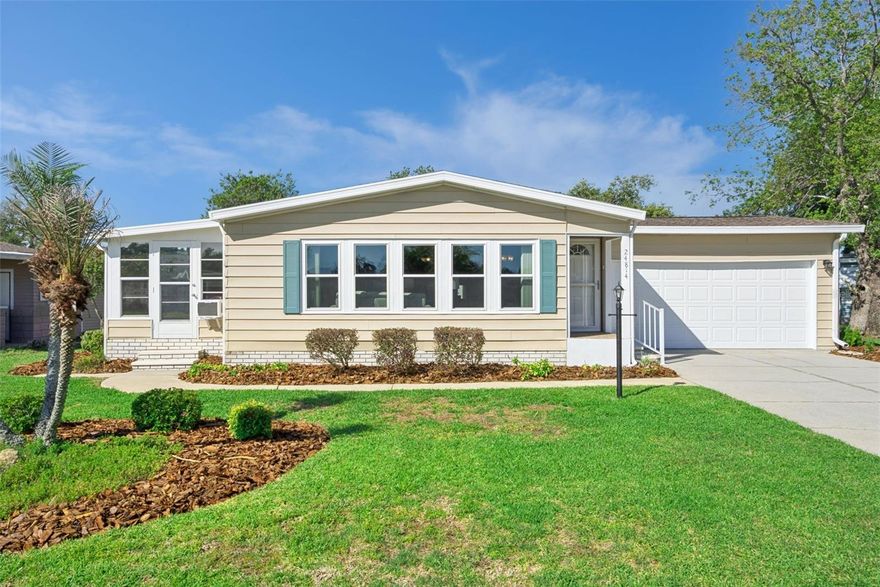 Located in the desirable 55+ community of Plantation at Leesburg, this well-maintained 2 bed, 2 bath home offers an open, airy floorplan with vaulted ceilings and a seamless flow between the living, dining, and kitchen spaces. **Home can come mostly furnished!** Situated on the quiet Pine Hill loop and just a short walk to the beautiful Manor Clubhouse - featuring one of the community’s most scenic pool settings with serene, private views - this location is hard to beat. The spacious enclosed lanai, finished with glass and screens, creates a true Florida room you can enjoy year-round. The kitchen includes all appliances, a breakfast bar, and a closet pantry, opening directly into the main living areas. Dining room features built-in cabinetry with glass display and additional storage. Primary suite offers a walk-in closet, dual sink vanity, and separate bath area. The second bedroom includes both a walk-in and additional closet, with guest bath nearby. Additional highlights include a built-in office space, abundant storage, and a 2-car garage with washer, dryer, utility sink, and garage door opener. Easy, low-maintenance living in a beautifully established community. Plantation of Leesburg offers a lifestyle of luxury and fun with 3 resort style pools, 2 Fitness Centers, Craft Rooms, Art Rooms, Billiards room, and so much more! Extra amenities such as pickleball, tennis, basketball, horseshoes, bocce courts, craft room, library, and so many planned activities will make sure you are living your best life. Plantation of Leesburg is conveniently located less than 30 minutes from the Villages, approximately an hour from Orlando’s International Airport, Disney and Universal theme parks, and less than two hours from the beaches on either coast. Discover the best of 55+ living at Plantations - where every day brings the opportunity to explore, relax, and enjoy the natural beauty that surrounds you! Call today for your private tour!