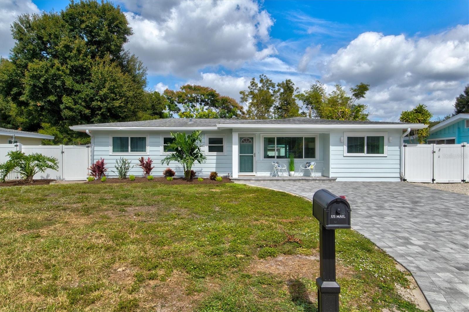 Welcome to Deja Blue, a designer pool home just minutes from downtown Sarasota & area beaches & walkable to Legacy Trail. This house offers designer comfort w/ room to spread out. Features include a huge heated swimming pool, fully fenced back yard, chef's kitchen with breakfast bar, separate dining area, dedicated work station w/ 2 desks, 5 flat screen tvs inside & out w/ fast wifi & complimentary streaming services, outdoor kitchen, BBQ grill, separate air-conditioned sunroom & in unit laundry.
As you pull up to this turn-key vacation rental you'll notice the curb appeal is excellent and inviting thanks to the newly expanded paver driveway, elevated front porch seating area, and manicured landscaping. Upon entering the home you can't help but be struck by the abundance of natural light due to the oversized flow through impact windows and the newly added window in the dining area. The living room is well appointed and can comfortably seat 6-8 people. It flows seamlessly into a workstation breezeway with side by side desks situated between the living room and the sun drenched and cozy sunroom with pullout queen sleeper. The central kitchen looks on to the stately dining room with seating for 8 and offers a breakfast bar with pendant lights, quartz countertops, and stainless appliances. The dining room offers views to the South facing front yard and shares space with the adjacent living room allowing everyone to take part in the conversation. Three well appointed bedrooms and two designer bathrooms occupy the west wing of the house.
The Master Suite is situated in the private SW front corner of the home and offers an en suite bathroom with tiled shower and seamless glass enclosure. This room has a king size bed, two nightstands a walk-in closet, dresser and flat screen TV.
The NW corner bedroom offers a queen size bed, 2 nightstands, a dresser, a wall of closet space and it's own flat screen TV.
The 3rd bedroom offers two twin beds with a shared nightstand with pendant light above. This room also offers closet space, a dresser and a flat screen TV.
All bedrooms offer ceiling fans for added comfort.
The oversized backyard is a tropical oasis. The centerpiece is the 28ft by 14ft heated in-ground swimming pool with brand new paver pool deck. There is cushioned seating space for 4 guests on the West side of the pool and 4 sun loungers and an outside dining table with adjustable umbrella on the other side of the pool.
A Napoleon 4-burner grill can play host to all of your grilling and entertaining needs. The backyard has been appointed with a tropical pitch apple hedge for privacy and the yard is large enough for dogs of any size to get their exercise (please clean up after your pets).
A storage shed houses beach chairs and accessories as well as a cornhole set for your gaming pleasure.
A covered and screened lanai area will be a great place to cool off and relax with views of the pool and tropical foliage. This area has a custom built outdoor kitchen with a bar, mini fridge, storage cabinets and an 85" flat screen TV to watch the games. There is also lounge seating on the covered lanai for 6 guests and a separate dining area as well.
The location is ideal with walkability to the Legacy Trail, Payne Park and the East end of Main Street. Area beaches are just a short drive as well. This home will not disappoint. Can be rented weekly, monthly or Seasonally at varying rates. Serious inquiries only.