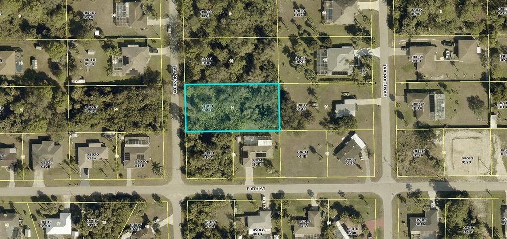 Photo of 602 Jackson Avenue, Lehigh Acres, FL 33972 (MLS # C7526174)