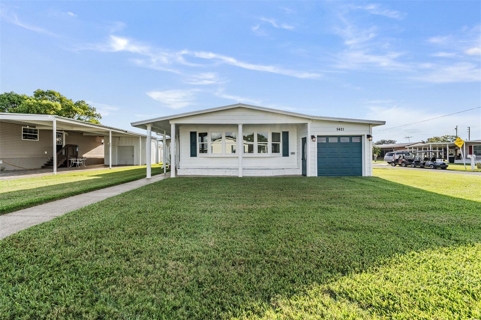 Welcome to this beautifully updated home in Betmar Acres, a sought-after 55+ golf course community where you own the land. Situated on a spacious corner lot with two driveways, this 2-bedroom, 2.5-bath home is designed with comfort, functionality, and entertaining in mind.
Step inside to a stunning custom kitchen featuring granite countertops, soft-close cabinets with pull-outs, a closet pantry, a breakfast bar/island, and newer appliances—including a hidden pull-out coffee bar that keeps your counters clutter-free. The kitchen flows seamlessly into the open-concept family room, dining area, and living room, making it perfect for gatherings.
The living room boasts energy-efficient 366 Low-E windows and an 86" surround sound TV—ideal for movie nights or game-day entertaining.
The primary bedroom comfortably fits a king-size bed and offers built-in under-bed storage, an en-suite bath with dual sinks, a step-in shower, and a custom built-in closet. The second bedroom is also generously sized with additional under-bed storage.
An indoor laundry area provides three extra closets for added storage. There is a tremendous amount of storage throughout this beautiful home.
Outside, a 13’ x 17’ workshop is a handyman’s dream, complete with additional storage space and a convenient half bath just off the workshop.
This meticulously updated home offers both luxury and practicality in a vibrant, amenity-rich community. Come see all that it has to offer!
On the other side of the home, you’ll find a spacious 10' x 22' golf cart garage—complete with a roll up door and 1 automatic garage door, for easy access from either side. This versatile space offers plenty of room not only for your golf cart but also for additional storage, making it perfect for tools, seasonal items, or hobby gear. Whether you're a golfer or just need extra room, this garage adds valuable functionality to the home. And as an added bonus, one of the golf carts is included!
In addition to all the impressive updates, this home offers a range of thoughtful upgrades that add both comfort and convenience. Luxury vinyl plank flooring runs throughout most of the home, providing durability and a stylish, modern look. A whole-house water filtration system installed for the refrigerator ensures clean, fresh water, and there's a dedicated water heater for the kitchen sink for instant hot water.
Other features include an in-wall safe for added peace of mind and chair-height toilets in each bathroom for ease and accessibility. Plus, the A/C unit was newly installed in 2024, offering energy efficiency and reliability for years to come. These upgrades make this home not just beautiful, but exceptionally livable.
Beyond the home, Betmar Acres offers an outstanding array of amenities to suit every interest and lifestyle. Enjoy 27 holes of golf, relax in one of two swimming pools, soak in the hot tubs, or take part in countless activities at any of the three clubhouses. The community also features a library, scenic walking paths, game rooms with billiards, table tennis, and board games, as well as miniature golf, enclosed shuffleboard courts, tennis and pickleball courts, a basketball court, bocce courts, and lively bingo nights.
There’s always something fun to do in Betmar—don’t miss your chance to make this incredible lifestyle yours! Call today to schedule your showing.