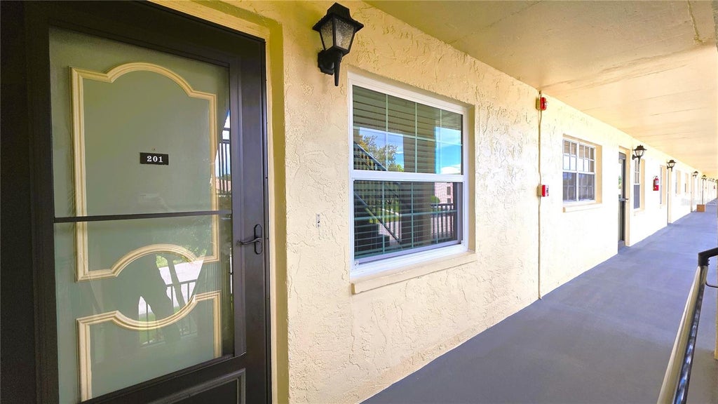 Photo of 1450 Heather Ridge Boulevard #201, Dunedin, FL 34698 (MLS # TB8546847)