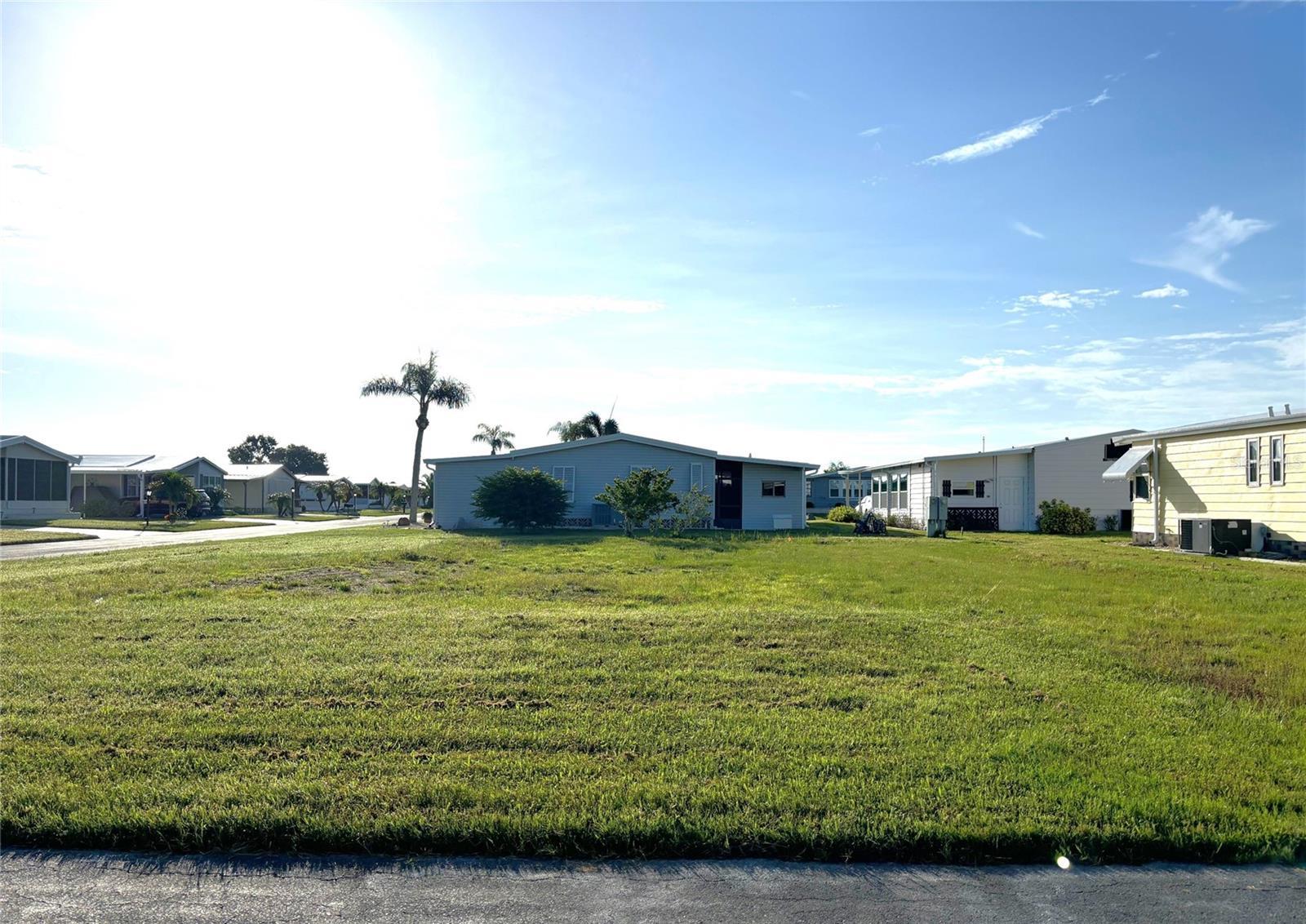 Large corner vacant lot in a vibrant 55+ community! La Casa offers the ultimate Florida lifestyle. We have 974 homes nestled among a variety of native trees with spacious common grounds surrounding our eight lakes. Located between Sarasota and Fort Myers, this is a boater's dream with access to the Gulf of Mexico. It is convenient for shopping, sightseeing, golfing, fishing, and boating, as well as all the culture and elegance the Southwest Florida area is noted for. La Casa may have the best pools in the area. Our crown jewel is an extremely large, 40 X 60-foot swimming pool that is kept at a perfect 87 degrees. Our smaller 20 x 40 pool is quietly nestled between the clubhouse and the Activity Building. Both pools have adjacent hot tubs which are ideal for soaking muscles that are tired from golfing or tennis. Wireless Internet (Wi-Fi) is available at the Clubhouse, Activity Building, and Recreation Hall area where these pools & spas are located, so you can catch some rays while you catch up on your email! Sound enticing? Come for a visit to this self-contained oasis and see for yourself why La Casa is the ultimate destination for both snowbirds and year-round residents!