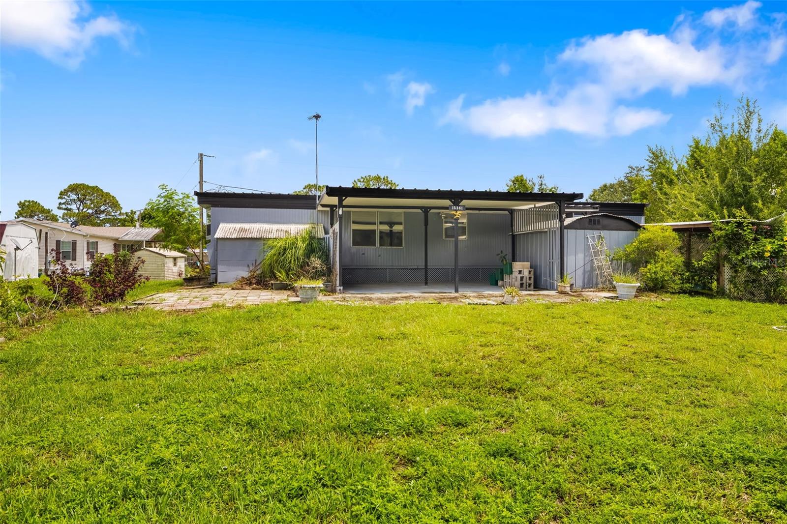 Dreaming of the Florida lifestyle without the HOA fees or restrictions? Welcome to 15381 Lime Dr. a hidden gem tucked away in a quiet, non-deed restricted neighborhood just moments from the waterfront excitement of the new Sunseeker Resort. Whether you're an avid angler, a weekend boater, or a foodie seeking world-class dining and shopping, this location places it all within easy reach.
This 1972 single-wide mobile home is full of potential and charm, featuring a covered carport, a handy storage shed, and an expansive frame-built addition. Use the extra space as a formal dining room, a home office, or divide it into two cozy bonus rooms ideal for guests, hobbies, or simply spreading out. Affordable, versatile, and located where the action meets tranquility, this property is perfect for seasonal living, investment, or your own personalized retreat. Come take a look and imagine the possibilities today!