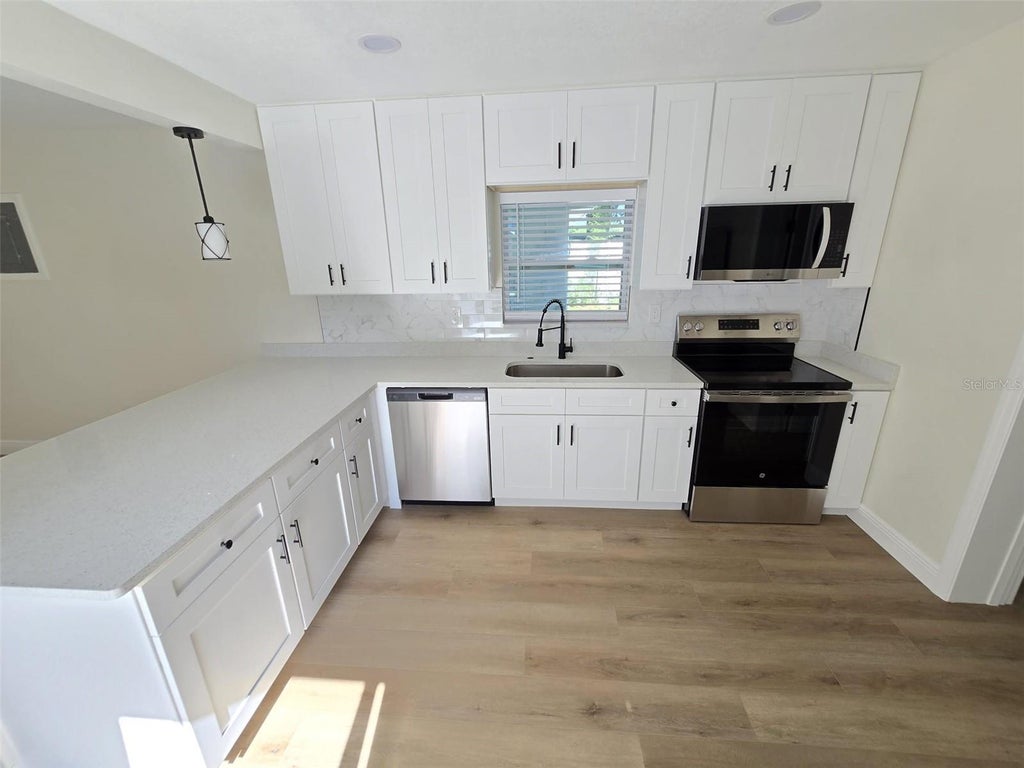 Photo of 416 W Ianthe Street #2, Tavares, FL 32778 (MLS # O6447471)