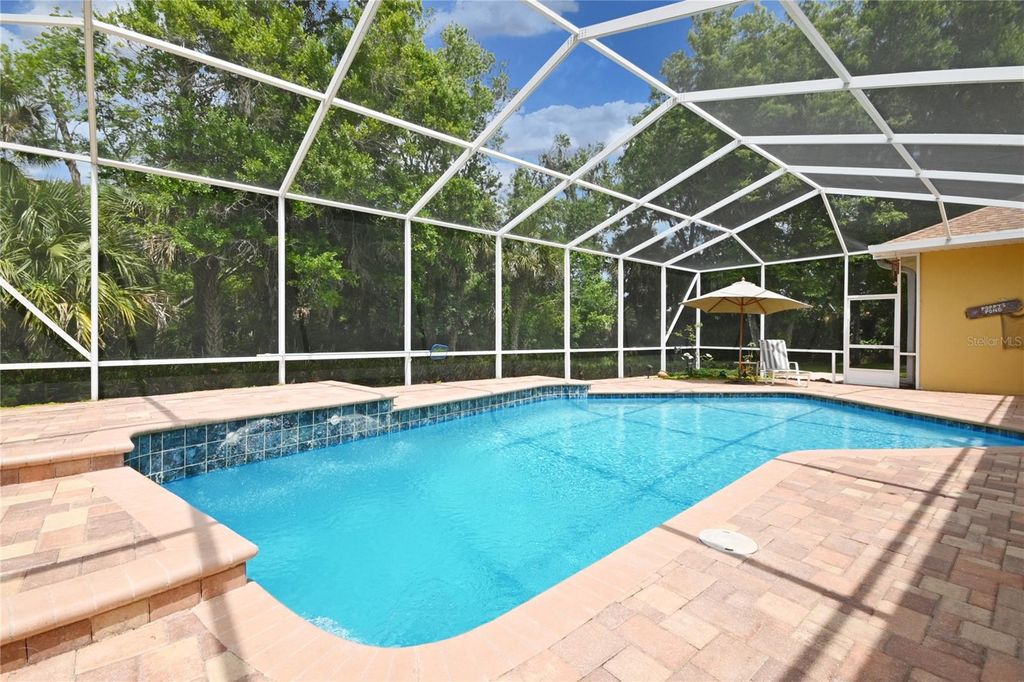 Photo of 1711 Hideaway Forest Trail, New Smyrna Beach, FL 32168 (MLS # NS1088124)