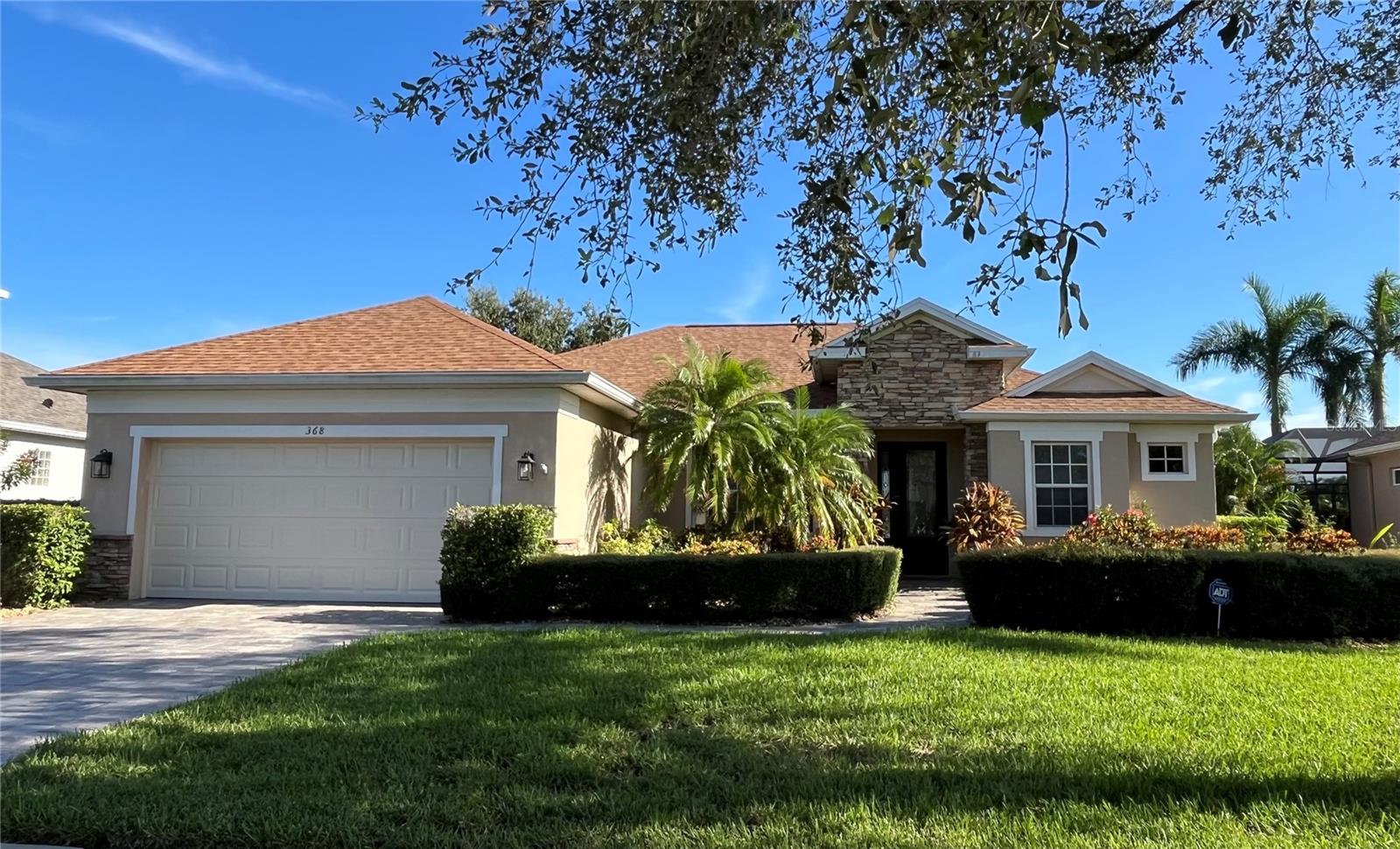 Located in the sought-after executive gated community of Greyhawk Landing, this stunning 4-bedroom, 3-bathroom home offers 2,271 sq. ft. of well-designed living space and the perfect blend of comfort, style, and luxury. Positioned on a premium lakefront lot, the home features a screened lanai with a heated pool and a fenced backyard—ideal for enjoying Florida's outdoor lifestyle. Step inside to find high ceilings, crown molding, and an open, airy layout filled with natural light. The home boasts two spacious living areas, a formal dining room, and a beautifully appointed kitchen with light cabinetry, granite countertops, stainless steel appliances, a breakfast bar, an eat-in area, and a pantry. The kitchen opens seamlessly to the family room, providing gorgeous views of the pool and lake. French doors from the living room, family room, and primary bedroom lead directly to the pool area. There is also access from the pool area to a full bathroom for added convenience. The primary suite serves as a peaceful retreat, offering a spa-like bathroom with dual vanities, a walk-in shower, soaking tub, a large walk-in closet, and an additional closet for extra storage. The guest bedrooms are generously sized, and both of the two additional full bathrooms feature walk-in showers. Additional highlights include a two-car garage, a laundry room with washer and dryer, and a paver driveway and walkway. Greyhawk Landing is known for its impressive amenities, which include a clubhouse, fitness center, resort-style pool with lap lanes and a splash pad, walking trails, playground, tennis courts, pickleball, and a basketball court. Conveniently located near shopping, dining, and more, this home truly has it all. All tenants are required to participate in the Resident Benefits Package (RBP) for $49.95/month which includes renters insurance, credit building to help boost your credit score with timely rent payments, $1M Identity Protection, HVAC air filter delivery (for applicable properties), move-in concierge service making utility connection and home service setup a breeze during your move-in, our best-in-class resident rewards program, and much more! More details upon application.
