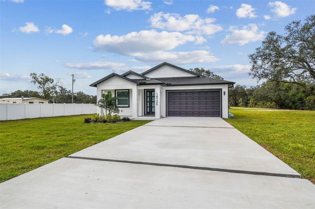 Photo of 14726 Elmont Ave, Spring Hill, FL 34610 (MLS # TB8433774)