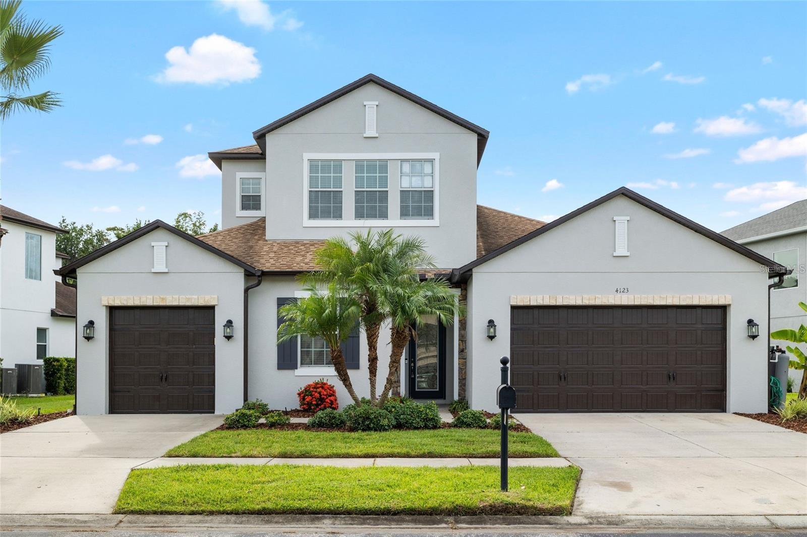 Stunning 5-Bedroom Pool Home in the Gated Community of Sabal Point at Seven Oaks! Welcome to Florida living at its finest! This meticulously maintained 5-bedroom, 4-bathroom, 3-car garage pool home offers 3,274 sq. ft. of versatile living space in the highly sought-after gated Sabal Point community of Seven Oaks. Step inside through the elegant 8-ft wrought iron and glass inset front door, where soaring tray ceilings create a grand entry. The open-concept layout is perfect for entertaining, with a gourmet kitchen that features 42” espresso wood cabinetry, granite countertops, a walk-in pantry, oversized island with bar seating, double oven, and stainless-steel appliances. The kitchen flows seamlessly into the spacious family room, with a wall of windows showcasing serene views of the sparkling pool and private conservation beyond. Relax and unwind in the luxurious owner’s suite, complete with dual vanities, a soaking garden tub, large walk-in shower, and expansive closet. An additional ensuite bedroom at the front of the home is ideal for guests, teens, or in-laws. Two more generously sized bedrooms and another full bath offer plenty of space for family or visitors. The laundry room includes 42” cabinets and a utility sink for added convenience. Upstairs, a beautiful wrought iron staircase leads to a massive flex space with a huge walk-in closet and full bath—perfect as a media room, home office, playroom, or bedroom. Step outside to your private retreat where a covered lanai overlooks the sparkling pool with a tranquil waterfall, the perfect spot to sip your morning coffee while watching deer wander through the conservation area. With thoughtful design, abundant storage, multiple living spaces, and options for a home gym or office, this home truly has it all. Recent updates include professionally cleaned carpets throughout and fresh, neutral interior paint coming soon, giving the home a move-in ready feel and a bright, modern touch. Seven Oaks residents also enjoy resort-style amenities including pools, clubhouse, fitness center, playgrounds, and sports courts—all with easy access to top-rated schools, shopping, dining, I-275, and I-75.