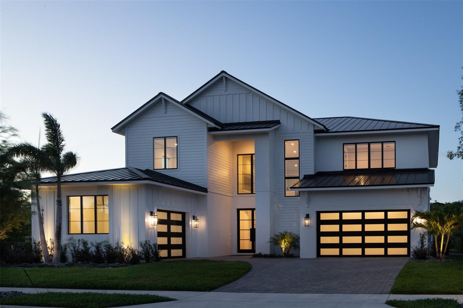 TO BE BUILT- Last lot available in the community- Nestled on the tranquil shores of Lake Sheen, part of the prestigious Butler Chain of Lakes, this stunning residence is located within the exclusive Lake Sheen Sound community—an intimate, private enclave offering a rare blend of seclusion and luxury. This BRAND NEW custom-designed home offers 4,463 square feet of beautifully crafted living space, featuring 5 spacious bedrooms, 4.5 luxurious baths, and a 3-car garage. The two story entry with custom staircase and oak wood floors opens to the great room with fireplace and built ins. The kitchen is located just off the great room and features top of the line Thermador appliances, custom cabinetry, waterfall edge island, stunning light fixtures and so much more. The thoughtfully designed floor plan includes a first-floor guest suite with a full bath and walk-in closet, offering privacy and comfort for guests. Step out onto the covered lanai with fully equipped summer kitchen, motorized screens and fabulous pool with fountains, all ideal for outdoor fun in the sun and relaxation. Travel upstairs along the beautifully crafted iron and wood stairway to the open loft, which leads to a private theater, loft, three additional bedrooms, and a convenient second laundry area. This second level offers the perfect combination of comfort and functionality for family living. The home’s finishes have been meticulously curated, showcasing a unique blend of elegance, craftsmanship, and contemporary style. From fixtures to flooring, every element has been carefully selected to ensure a one-of-a-kind residence you won’t find replicated anywhere else. Escape to the spa-inspired master suite retreat, designed for ultimate relaxation and privacy. This serene space features a luxurious bath, elegant finishes, and a spacious walk-in closet, creating a true sanctuary within the home. Built by Element Home Builders, the exclusive builder of Lake Sheen Sound, this residence reflects the highest standards of craftsmanship, design, and attention to detail. Experience the beauty of lakeside living in a quiet, intimate community that offers both natural surroundings and modern sophistication. Ideally located just minutes from top-rated Orlando public and private schools, as well as premier destinations like Walt Disney World® and the Four Seasons Resort Orlando, this home offers the perfect balance of convenience, luxury, and lifestyle. Please note: The photos shown are of the Channelside floor plan, offered through Element Home Builders. This is just one example of the thoughtfully designed layouts available to you. Buyers are welcome to choose from any of Element’s Lake Sheen Sound available floor plans to create the home that best fits their lifestyle and vision.