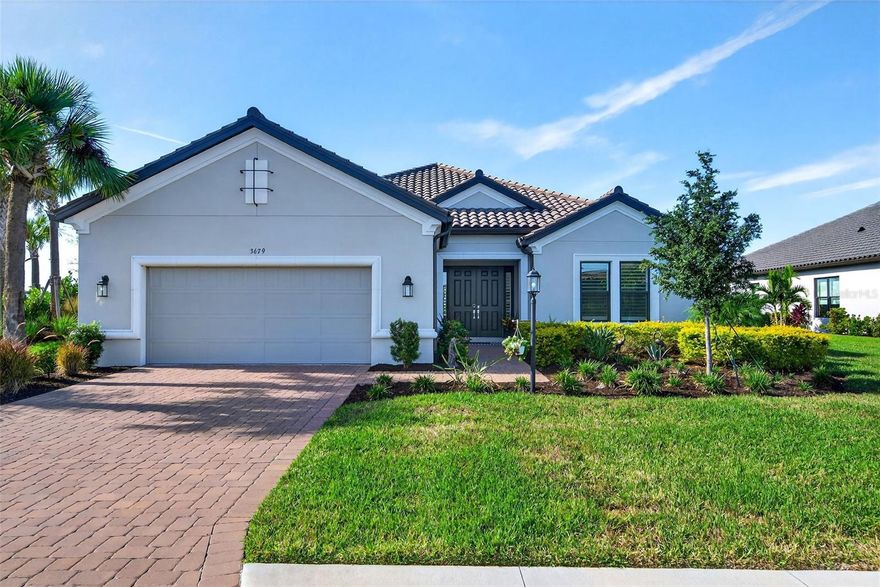 Welcome to this spectacular Pallazio home design offering 3,055 square feet of pure luxury and resort-style living! This highly sought-after open-concept floor plan features 3 Bedrooms plus an Office and endless upgrades, perfect for modern living and entertaining.

The heart of the home is the expansive central common area, seamlessly connecting the Living Room, Kitchen, and Dining Area. The Living Room is an elegant space boasting an extraordinary tray ceiling and a cozy fireplace, setting the perfect ambiance. The gourmet Kitchen shines with a large island, a convenient step-in pantry, and is ready for culinary adventures! Gorgeous ceiling fans throughout add comfort and style.

Retreat to the luxurious, tucked-away Primary Suite at the back of the home. The elegant bedroom opens via double doors to the finely appointed Primary Bath, featuring dual sinks, a large shower, and a private water closet. The oversized walk-in closet completes this serene sanctuary.

Guests or loved ones will feel spoiled with two well-appointed Bedrooms. One offers a private full bath with a shower, while the other is conveniently located adjacent to another full bath.

Enjoy the Florida lifestyle year-round on the expansive lanai, accessible via sliding glass doors from both the Kitchen and Great Room. This fabulous outdoor space is equipped with an outdoor kitchen, perfect for al fresco dining and entertaining!

This home is situated within the highly desirable, gated community of Esplanade at Azario Lakewood Ranch. Conveniently located in Southeastern Manatee County, this neighborhood offers an unparalleled array of lifestyle and recreational opportunities. Community amenities include the Bahama Bar, sparkling pool, wellness center (complete with gym, spa, and salon!), bark park, bocce ball courts, and an incredible 18-hole golf course! Enjoy lifestyle-directed activities every day, making everyday feel like a vacation! The central location ensures easy travel to downtown, fantastic shopping, and major medical areas, with major tourist attractions just a comfortable drive away.

Don't miss the opportunity to live the dream in this magnificent home!