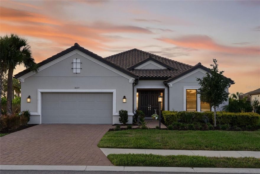 Welcome to this spectacular Pallazio home design offering 3,055 square feet of pure luxury and resort-style living! This highly sought-after open-concept floor plan features 3 Bedrooms plus an Office and endless upgrades, perfect for modern living and entertaining.

The heart of the home is the expansive central common area, seamlessly connecting the Living Room, Kitchen, and Dining Area. The Living Room is an elegant space boasting an extraordinary tray ceiling and a cozy fireplace, setting the perfect ambiance. The gourmet Kitchen shines with a large island, a convenient step-in pantry, and is ready for culinary adventures! Gorgeous ceiling fans throughout add comfort and style.

Retreat to the luxurious, tucked-away Primary Suite at the back of the home. The elegant bedroom opens via double doors to the finely appointed Primary Bath, featuring dual sinks, a large shower, and a private water closet. The oversized walk-in closet completes this serene sanctuary.

Guests or loved ones will feel spoiled with two well-appointed Bedrooms. One offers a private full bath with a shower, while the other is conveniently located adjacent to another full bath.

Enjoy the Florida lifestyle year-round on the expansive lanai, accessible via sliding glass doors from both the Kitchen and Great Room. This fabulous outdoor space is equipped with an outdoor kitchen, perfect for al fresco dining and entertaining!

This home is situated within the highly desirable, gated community of Esplanade at Azario Lakewood Ranch. Conveniently located in Southeastern Manatee County, this neighborhood offers an unparalleled array of lifestyle and recreational opportunities. Community amenities include the Bahama Bar, sparkling pool, wellness center (complete with gym, spa, and salon!), bark park, bocce ball courts, and an incredible 18-hole golf course! Enjoy lifestyle-directed activities every day, making everyday feel like a vacation! The central location ensures easy travel to downtown, fantastic shopping, and major medical areas, with major tourist attractions just a comfortable drive away.

Don't miss the opportunity to live the dream in this magnificent home!