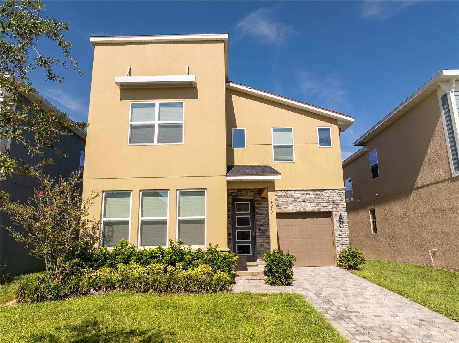 Welcome to 2370 Salty Winds Way, a stunning two-story home located in the highly desirable gated community of Solara Resort in Kissimmee. Built in 2023, this fully furnished 6-bedroom, 3.5-bathroom property is ideal for use as a vacation home, short-term rental, or full-time residence. Inside, you'll find an open-concept layout filled with natural light, high ceilings, and modern finishes. The spacious kitchen features stainless steel appliances and a large center island perfect for cooking and entertaining. Each bedroom is thoughtfully furnished and includes its own TV, offering comfort and convenience for guests or family members.
Step outside to your private screened-in pool and spa, along with a covered lanai that provides the perfect space for relaxing or hosting. The home is located just minutes from world-renowned attractions such as Walt Disney World and Universal Studios, as well as shopping, dining, and major highways. Residents and guests also enjoy access to premium resort-style amenities including a clubhouse, pool, fitness center, and more. This home offers the perfect combination of style, location, and functionality—all within a vibrant vacation-friendly community.