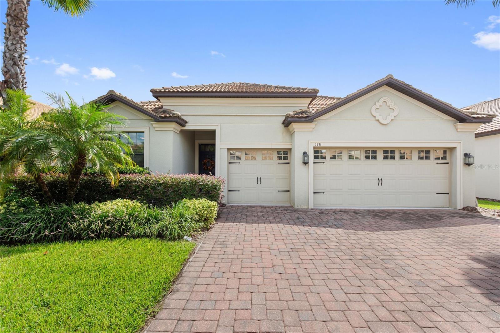 FULL GOLF & TENNIS MEMBERSHIP INCLUDED with your HOA! Live like a champion in this beautifully maintained 4-bedroom, 3-bath home with a spacious 3-car garage, ideally located in the highly sought-after Phase 1 of ChampionsGate Country Club. From the moment you arrive, pride of ownership is evident. This light-filled, move-in-ready home features an open-concept layout designed for effortless living and entertaining. The chef’s kitchen is a dream come true, boasting granite countertops, 42” solid wood cabinetry, and diagonally laid 18” tile flooring throughout the main living areas. The luxurious primary suite offers a spa-like retreat with dual vanities, a soaking tub, and a walk-in shower. Relax on your east-facing screened lanai, the perfect spot to enjoy rocket launches, hot air balloons, and evening fireworks. Professionally landscaped grounds add to the home’s impressive curb appeal. Perfectly positioned just steps away from The Plaza and a short walk to the golf course and Oasis Club, this home offers unmatched access to world-class amenities. The Oasis Club is a private 14,000+ sq ft clubhouse featuring a restaurant, bar, lazy river, movie theater, waterslide, fitness center, game room, and more. Homeowners also enjoy exclusive access to The Plaza’s private clubhouse, which includes a $75/month food and beverage credit at the restaurant, pickleball courts, two additional pools, and a second fitness center. You’ll also enjoy the all-new Retreat Club with a full water park, putt-putt, restaurant, and bar. The HOA includes all of these resort-style amenities plus lawn care, gated security, cable, high-speed internet, phone service—and even the CDD and trash collection are already included in your taxes! Located just minutes from Orlando’s world-famous theme parks, top-rated dining, shopping, and major highways, this home offers the ultimate combination of luxury, convenience, and resort-style living. Homes like this don’t come around often, schedule your private showing today!