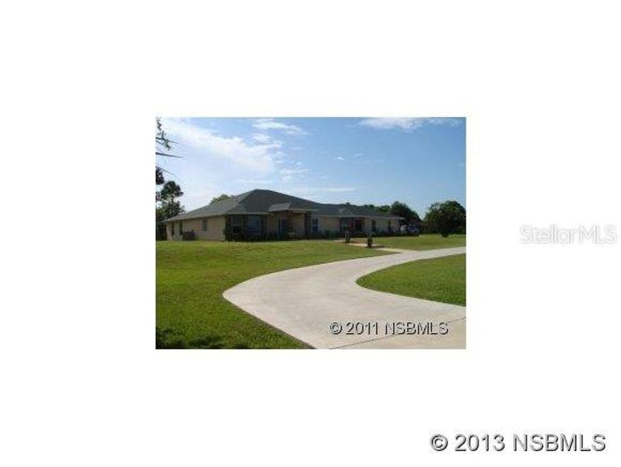 ABSOLUTELY SPECTACULAR CUSTOM DESIGNED POOL HOME ON 2.78 CLEARED ACRES. BEAUTIFULLY LANDSCAPED FRONT WITH BRICK ACCENTS LOCATED IN THE HEART OF NSB CIRCULAR DRIVE AND SIDE ENTRY 2 CAR GARAGE. INGROUND HEATED POOL WITH HOT TUB,WATERFALL ON A LOW MAINTENANCE SALT FILTRATION SYSTEM FOR ECONOMIC EFFICIENCY. UPGRADES ARE ENDLESS, GRANITE COUNTERS THROUGHOUT, LARGE DIAGONAL CERAMIC TILE, BEAUTIFUL ACCENTS, DOME CEILING. FOYER ENTRY WITH CIRCULAR MEDALLION. LARGE ROOMS, VAULTED CEILING WITH ADDITIONAL ROOM WITH DOUBLE FRENCH DOOR ENTRY BEING USED AS GAME ROOM BUT EASILY COULD BE CONVERTED TO 5TH BEDROOM OR FAMILY ROOM. 2 BAY WINDOWS, HUGE TILED BACK PORCH WITH WOOD CEILING AND PADDLE FANS. FIREPLACE IS ELECTRIC AND FOR LOOKS ONLY. PLANT LEDGES, LIGHTED CHERRY CABINETS IN KITCHEN AS WELL AS A HUGE COUNTER TOP THAT TAKES AWAY THE NEED FOR AN ISLAND. APPLIANCES ARE STAINLESS STEEL. BEDROOM FOUR IS ALSO AND IN-LAW SUITE. MASTER SUITE FEATURES HUGE BATHROOM WITH TWO WALK IN CLOSETS AND THERE ARE FRENCH DOORS LEADING AOUT TO THE BACK YARD AND POOL AREA.LOTS OF STORAGE IN THE ATTIC. IN DOOR UTILITY ROOM HAS DEEP SINK AND WILL HOLD LARGE CAPACITY WASHER AND DRYER WITH ROOM TO SPARE. EXTERIOR HOT/COLD SHOWER OUTSIDE WITH POOL BATH ENTRY. HORSES PERMITTED AND A HUGE BONFIRE PIT OUT BACK... ;Water: City