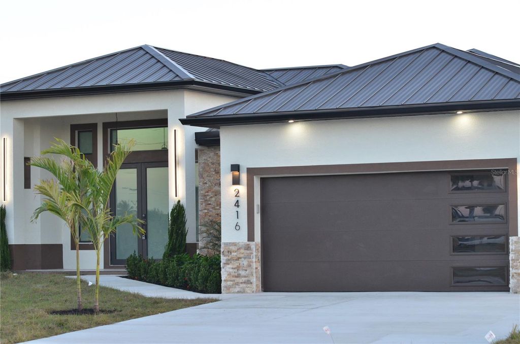 Photo of 2416 Diplomat Parkway W, Cape Coral, FL 33993 (MLS # O6403307)