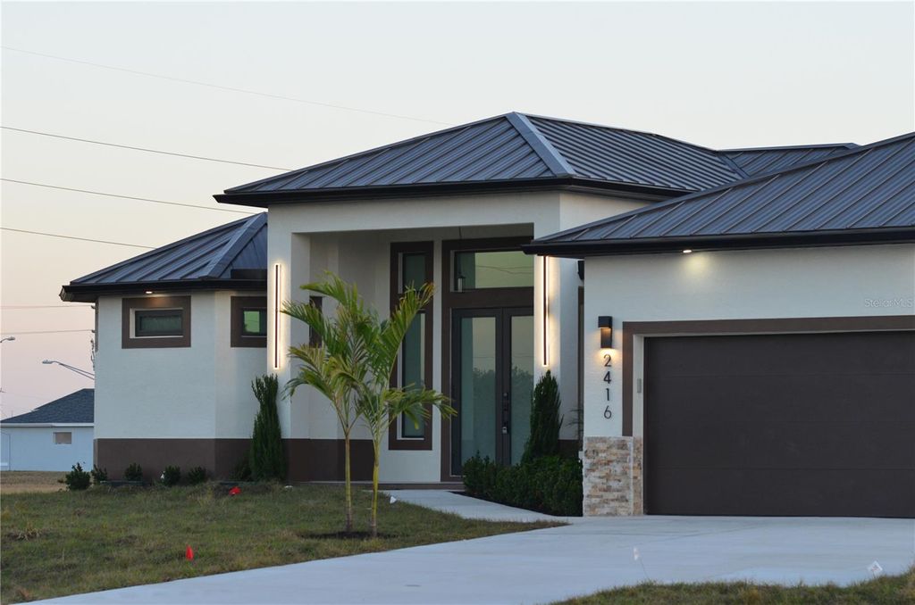 Photo of 2416 Diplomat Parkway W, Cape Coral, FL 33993 (MLS # O6403307)
