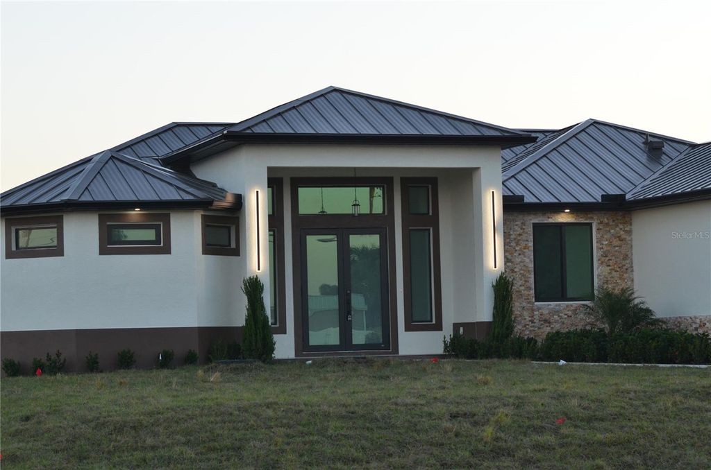 Photo of 2416 Diplomat Parkway W, Cape Coral, FL 33993 (MLS # O6403307)