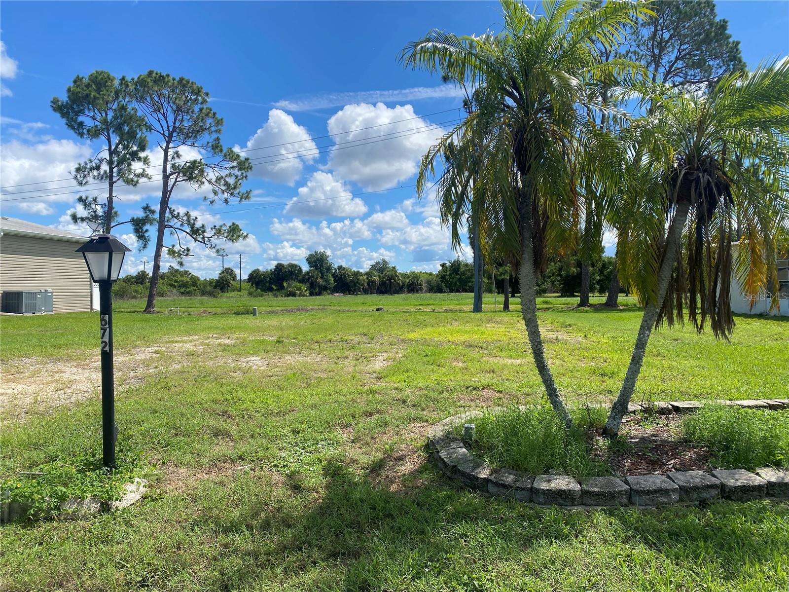 Imagine the possibilities with this expansive vacant lot, perfectly positioned for your dream home! Nestled against a stunning 40-acre tract, this property offers the ideal blend of tranquility and accessibility. Just a stone’s throw away from the boat ramp and dock, it’s a paradise for water enthusiasts and nature lovers alike. Don't miss the chance to create the home you've always envisioned in this serene setting! New backflow preventer has been installed. Survey with elevations has been completed. Welcome to La Casa, an enchanting community where 974 exquisite homes are beautifully set among native trees, surrounded by spacious common areas and eight serene lakes. Our generous 60 by 80-foot lots can create your ideal space. Perfectly located between Sarasota and Fort Myers, La Casa is a boater's paradise with direct access to the stunning Gulf of Mexico. Enjoy easy access to shopping, sightseeing, golfing, and fishing, all while immersing yourself in the rich culture of Southwest Florida. Experience the warmth of Southwest Florida’s winters in a relaxed environment, far from the east coast hustle. Our lush, mature landscaping reflects the dedicated care of residents and management. La Casa features some of the finest pools in the area, including our magnificent 40 by 60-foot swimming pool, maintained at a delightful 87 degrees, and a cozy 20 by 40-foot pool nestled between the clubhouse and Activity Building, both with inviting hot tubs. Stay connected with our complimentary Wi-Fi at the Clubhouse, Activity Building, and Recreation Hall while you soak up the sun. La Casa is a family-friendly haven where you can enjoy tranquility while remaining close to vibrant attractions. Come visit our charming oasis and discover why La Casa is the ultimate destination for snowbirds and year-round residents!