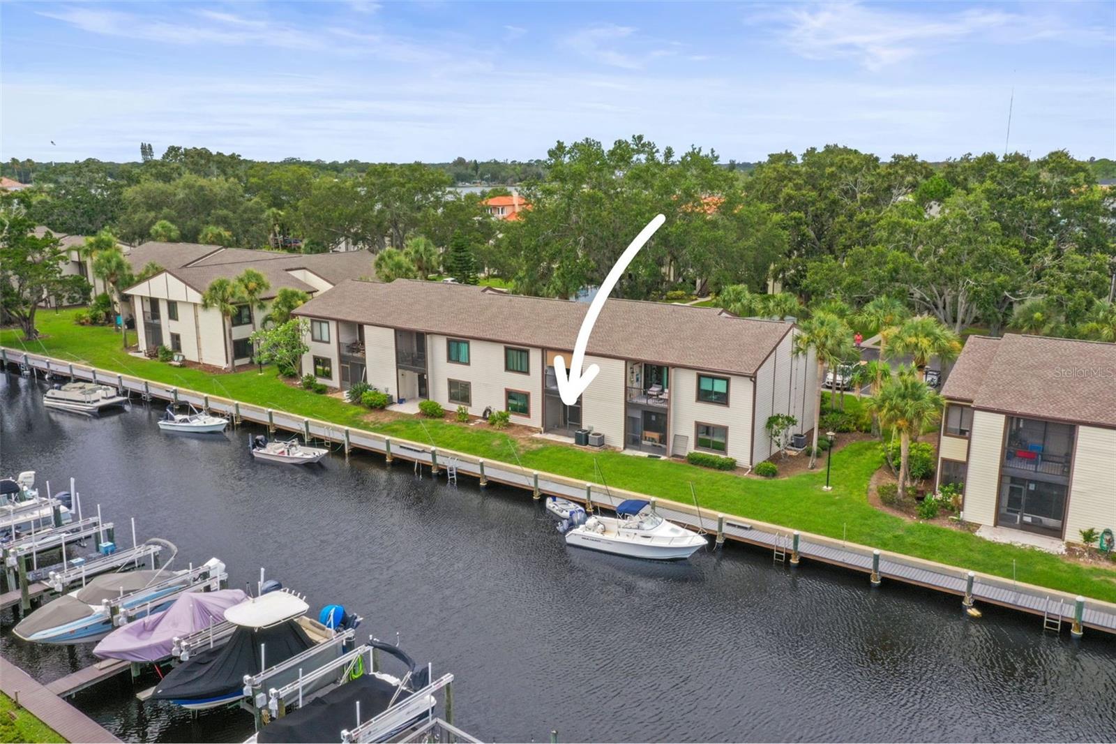 One or more photo(s) has been virtually staged. Welcome to your own slice of paradise in the heart of Tarpon Springs! This 2-bedroom, 1-bathroom first-floor condo offers breathtaking water views, a screened-in porch, and the unique opportunity to keep your boat docked right in your backyard. Located just steps from the community boat slips, this unit offers boat slip space on a first-come, first-serve basis—and right now, there are plenty of slips available for you to choose from. Currently undergoing a complete renovation from top to bottom, this condo is being thoughtfully rebuilt after experiencing flooding from recent hurricanes—giving you peace of mind with brand new finishes, systems, and materials. Renovations are expected to be completed in the next few months, so you can enjoy the rest of summer in your fully updated waterfront retreat.
Inside, you’ll find hurricane-rated storm windows—paid for by the seller—that provide added protection and comfort, a brand-new A/C system, and all new appliances ready for you to cook your very first meal in your stunning new kitchen. Every inch of this condo is being tastefully updated with modern coastal charm and attention to detail. Relax and take in the tranquil surroundings from your private screened-in porch or unwind at the community pool nestled along the waterfront, perfect for peaceful afternoons in the Florida sun. This quiet, friendly condo community is ideally located just minutes from the world-famous Tarpon Springs Sponge Docks, boutique shopping, fabulous restaurants, and scenic parks. Don’t miss this one-of-a-kind, tastefully renovated Tarpon Springs condo—a rare opportunity to enjoy waterfront living, boat access, and all the benefits of a brand-new interior in a well-established, serene community.
This is coastal living at its finest—secure your spot before it's gone and make this condo your NextHome!
