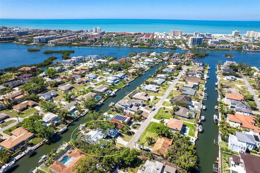 Seller will consider all reasonable offers.
Discover the ultimate boater’s retreat with this exceptional three-bedroom, two-bath home, perfectly positioned West of Trail on the highly coveted Aqualane Canal. Offering over 100 feet of prime waterfront, this property provides saltwater access with effortless passage to Little Sarasota Bay, Robert’s Bay, and the Intracoastal Waterway—an ideal setting for boating enthusiasts and anglers. A private dock equipped with a 12,000-pound boat lift and an additional davit accommodates multiple vessels with ease. Enjoy added peace of mind knowing this home experienced no flooding or storm damage from Ian, Helene, or Milton.
Step inside and take in the stunning water views and backyard oasis that define this home’s appeal. The expansive patio is designed for relaxation and entertaining, featuring a cozy fire pit, landscape and waterfall lighting, and a tranquil koi pond. The meticulously landscaped yard includes drip irrigation and solar lighting for added efficiency and charm.
The spacious interior showcases an open floor plan with elegant Travertine tile throughout much of the living area. The stylish kitchen features white cabinetry, tempered glass countertops, and premium GE and LG appliances—perfect for everyday living and entertaining. The generous master suite is a private sanctuary, complete with an en suite bath, double vanity, custom glass shower, and two large walk-in closets plus a linen closet. Two additional bedrooms offer versatility, with one currently used as an office. The guest bathroom is beautifully appointed with wood cabinetry, granite countertops, and a luxurious jetted tub.
This impeccably maintained home is loaded with upgrades, including a whole-house generator, large propane tank, tankless water heater, AC with a 3-step capacitor, and a new electrical panel (2023). The impressive four-bay split garage (24x23 and 24x27) offers abundant storage for vehicles and recreational toys and includes a smart garage door opener. A Coral stone wood-burning fireplace with supplemental gas assist brings timeless character and warmth to the living space. Additional conveniences include a well-designed laundry room with custom storage and a utility tub, plus a hot-water outdoor hose bib—perfect for pet owners. A durable metal roof ensures lasting protection and storm resistance.
Recent improvements include updated landscaping with uplighting, new sod and stone, and a new septic drain field installed approximately four years ago. Extensively remodeled in 2016, this remarkable waterfront residence blends luxury, comfort, and the quintessential boating lifestyle.
Don’t miss this rare opportunity to own a slice of paradise West of Trail. Schedule your private showing today!