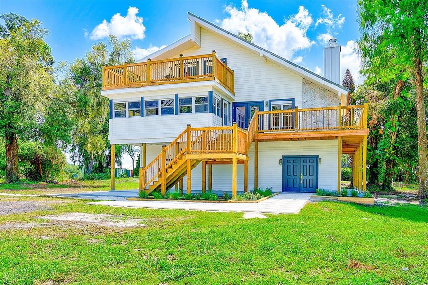 GORGEOUS PLANT CITY FARMHOUSE ON 2.25 ACRES. Welcome to your private sanctuary set back on over 2 acres, this fully reborn home has been renovated from the ground up and offers all the peace and tranquility imaginable. With 4 bedrooms, 3 bathrooms and a wide open lower level with its own entrance, this home flexes to your vision: add extra bedrooms, design a game room, a dream office, or create separate living quarters for guests or rental income. Every detail has been reimagined. New stabilized foundation, roof, septic, well pump, HVAC including ducts, electrical, plumbing, siding, windows, flooring, kitchen and bathrooms, plus a wrap-around deck that invites sunrise coffee and sunset escapes. This isn't just a renovation, it's a resurrection of modern luxury and timeless charm, waiting to become your forever home. Minutes to I-4. Easy commute to Tampa, Lakeland and Orlando. Close to shopping and dining. There is a chicken coop and another small barn, both needing TLC. Seller believes, but buyer needs to verify, the possibility to divide and sell the front one acre portion.