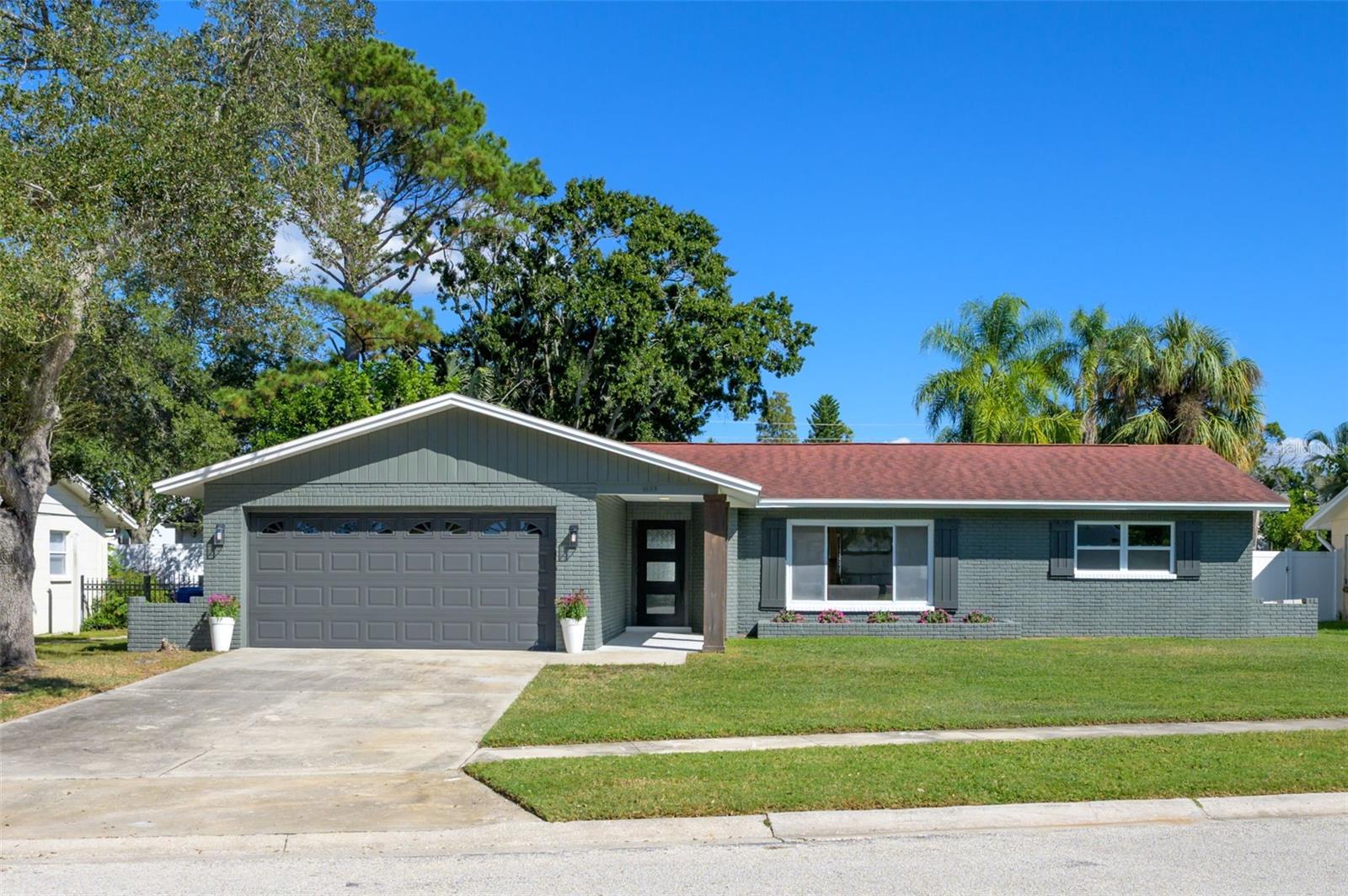 Welcome to this beautifully remodeled 3 bedroom, 2 bathroom pool home nestled in a charming sought-after neighborhood in St. Petersburg. This home is a perfect blend of modern luxury, versatile living, and timeless Florida charm. From the moment you step inside, you’re greeted by abundant natural light, and an open-concept split floor plan designed to impress.
At the heart of the home, the chef-inspired kitchen anchors the living space with a large center island that invites conversation and seamless entertaining. Whether you’re hosting dinner parties or casual gatherings, the flow from kitchen to living area and out through the double-door patio creates the ultimate indoor-outdoor experience. Step outside to your private pool and patio retreat, an intimate oasis designed for sun-drenched weekends, barbecues, and unforgettable moments with family and friends.
A bonus living space offers endless possibilities and allows you to create your HGTV vision to transform it into a cozy family room, stylish home office, or vibrant game room tailored to fit your lifestyle.
The primary suite is a tranquil retreat with a generous walk-in closet and room for a king-sized bed, while the two additional guest bedrooms are spacious and share a beautifully updated bathroom, creating a guest-suite feel on the opposite side of the home.
Outside, the fully fenced backyard is ideal for four-legged friends, and the two-car garage offers plenty of storage. With a newer roof, A/C, and water heater, plus a $5,000 appliance allowance so you can customize your dream kitchen, this home is truly move-in ready.
Perfectly positioned just minutes from Downtown St. Pete, the Gulf’s pristine beaches, renowned restaurants, boutique shops, and championship golf courses, this home embodies the effortless sophistication of Florida luxury living. Whether you’re envisioning vibrant gatherings or tranquil everyday moments, this property offers the best of both worlds. Don’t miss your chance to claim your piece of luxury Florida living before it’s gone!