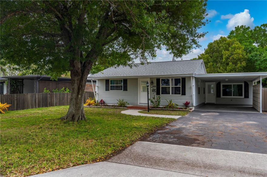 One or more photo(s) has been virtually staged. IMMACULATE 2 BEDROOM, 2 BATH HOME, with NEWER ROOF 2023, offers comfort, flexibility, and a fantastic location! Inside, you’ll find a spacious living area and an updated kitchen equipped with newer appliances, including a 2025 GE refrigerator, 2026 GE microwave, and 2024 Honeywell dishwasher. The open dining/living space is ideal for entertaining, while the second bathroom conveniently doubles as a laundry room including a Samsung washer. A standout feature is the large bonus room with new storm windows. This multi-purpose space is perfect as a home office/den combination, a family room, or easily converted into a third bedroom to suit your needs. Beautiful laminate flooring flows throughout the home and is complemented by the soft painted interior. Step outside to the oversized screened and covered back lanai overlooking a fully wood-fenced backyard, complete with a detached 21’x15’ single-car garage and a storage/workshop. The garage has alley access through the wooden gate. The front of the home offers a covered carport. This home is perfect for a rental investment, a snow-bird retreat or for enjoying Florida living year-round. Just minutes from Historic Downtown Punta Gorda and conveniently located near schools, Interstate I-75, the Punta Gorda Airport, as well as a variety of local amenities. Enjoy this waterfront community which offers parks, walking/biking paths, fishing, restaurants and much more. This home is a wonderful opportunity to enjoy both charm and convenience in one great package!