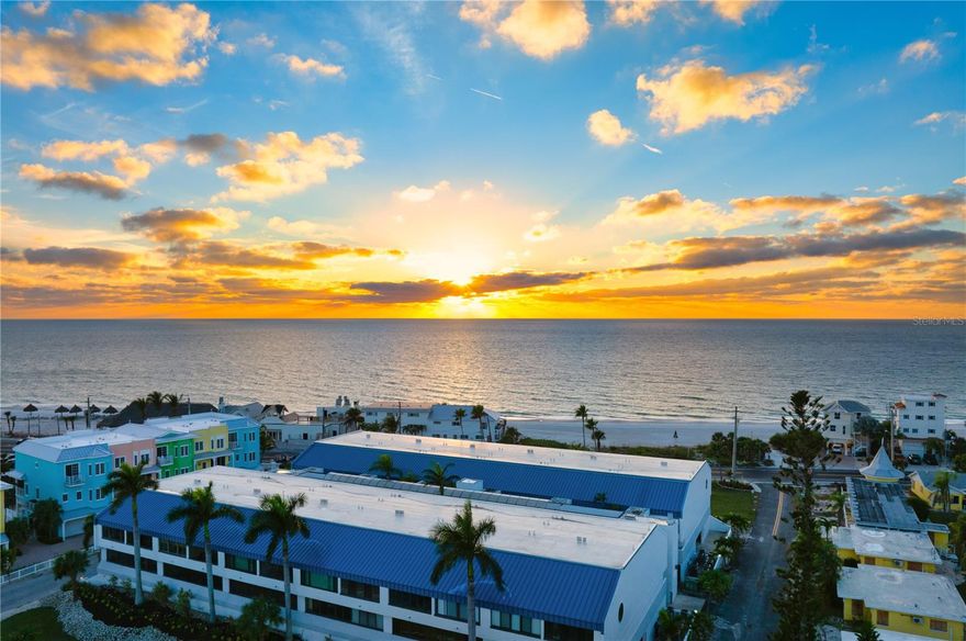 New, new, new.... Just Listed! Beachfront Condo with STUNNING GULF VIEWS! Experience the ultimate in coastal living with this beautifully updated kitchen with quartz countertops, NEW half bath, NEW roof, refurbished elevator, and a refreshed pool (all new pool heaters, pumps, etc.), spa, deck and bathhouse. Every detail has been updated for comfort, style, and peace of mind. From the moment you enter this freshly painted condo you will be captivated by the uninterrupted, direct Gulf views and the sparkling waters of the Gulf of Mexico which are front and center. Enjoy breathtaking sunsets from your open-concept great room and kitchen, and start your mornings with peaceful sunrises from the bayfront heated pool, hot tub, or fishing/boat dock. This elevated BEACH-TO-BAY community is a hidden gem, known for its quiet ambiance and friendly, long-term residents. The deeded beachfront property, owned by the association, ensures your panoramic views will never be obstructed. Even better, this 3rd story unit remained high and dry through the most recent hurricanes, offering extra peace of mind. Inside, the condo features vaulted ceilings, new luxury vinyl plank flooring, and an enclosed lanai that opens to the soothing sound of waves. The two spacious bedrooms provide flexibility as one currently serves as an office and workout space. Safety, maintenance and financial stability are a hallmark of this community. Summer Sands reserves are fully funded and the building easily passed the Florida Milestone Inspection required by the State to verify structural integrity. Located just a short walk from Bridge Street's shopping, dining, and nightlife, and steps from the free Island Trolley, this home includes two under-building parking spaces with secure elevator and stairwell access. The pool complex also has a patio with a grill and picnic table as well as new kayak/paddleboard storage. The all-new landscaping of the entire property has been professionally designed, including the lush and peaceful atrium. This is your chance to own a condo with the very best of Anna Maria island living.