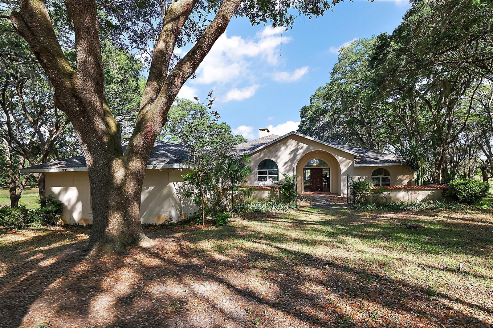 Welcome to Fox Run, a stunning 25-acre retreat nestled in the heart of Central Florida. This exceptional property offers a spacious 3-bedroom, 2-bathroom home, perfect for comfortable living and entertaining. The estate features a generous 4-car garage, a versatile 6-stall barn with a tack room—ideal for equestrian enthusiasts—and ample storage with a pole barn for tractors and equipment, plus a storage shed. Roof is 2024 along with the well system. Enjoy the tranquility of rural living while remaining conveniently close to nearby cities, providing the perfect balance of privacy and accessibility. The property grants exclusive access to Nicotoon Lake, renowned for its abundant bluegill, crappie, and largemouth bass—perfect for fishing and outdoor recreation. Nature lovers will appreciate the diverse wildlife that calls Fox Run home, including resident deer, foxes, bobcats, sandhill cranes, and even the occasional black bear. Experience the peaceful serenity and natural beauty that make this property truly special. Please note: All visits require an appointment with a licensed real estate agent. Unauthorized entry will be considered trespassing and will be handled accordingly. Don’t miss this one-of-a-kind opportunity to own your piece of Central Florida paradise!