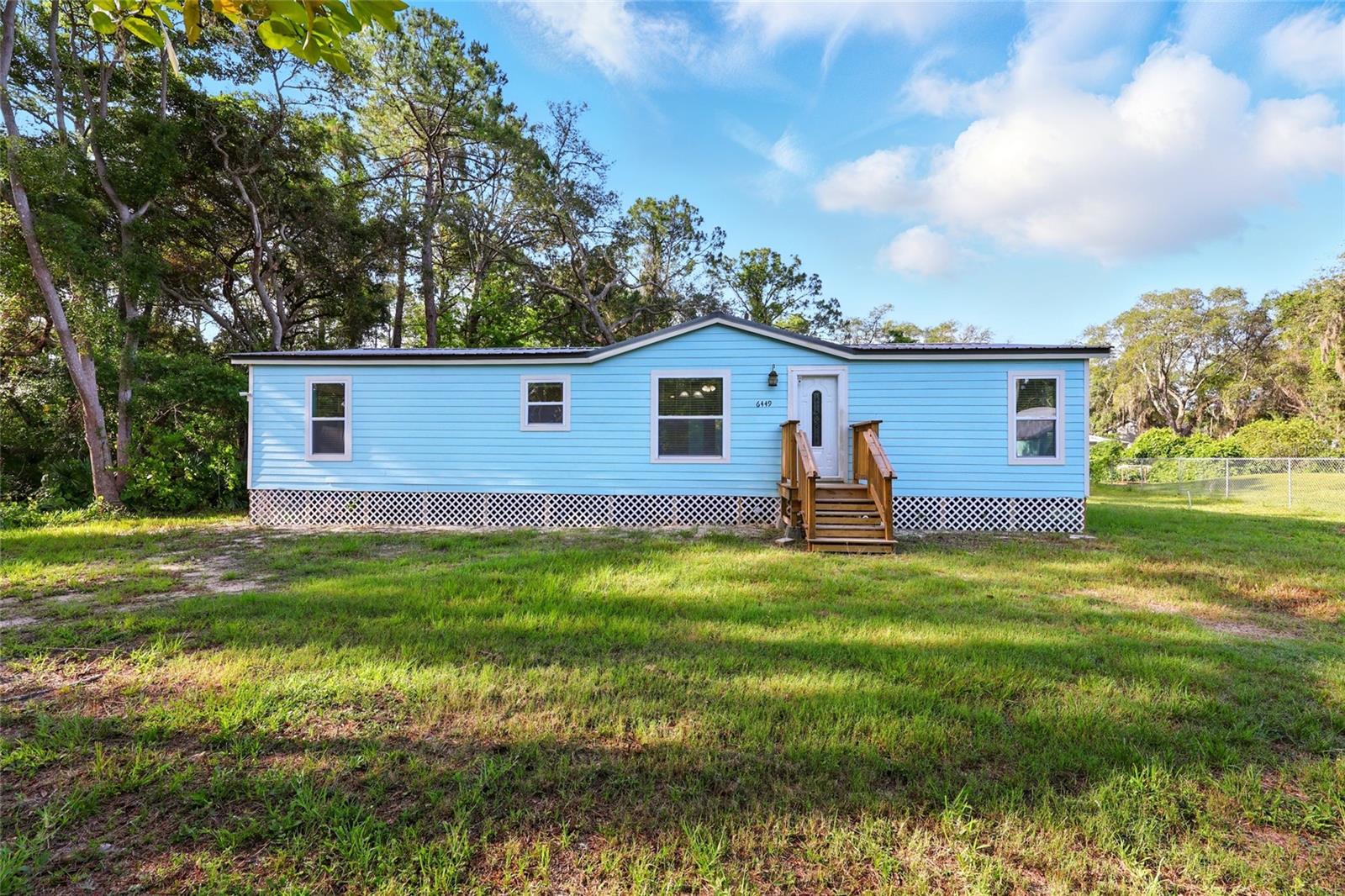 Enjoy the ease of move-in ready living with this beautifully updated home in St. Johns County. This recently relocated and exceptionally clean 1995 manufactured home sits on a .29± acre lot and offers 3 bedrooms, 2 bathrooms, and a bright, open-concept layout designed for everyday comfort and effortless entertaining. The spacious kitchen flows into the main living area with tile flooring and recessed lighting throughout. The primary suite is a true retreat, featuring a spa-like bathroom with dual sinks, a large walk-in shower, and an oversized walk-in closet. With durable Hardie board siding, a metal roof, and a new hot water heater (2025), the home is built for low-maintenance peace of mind. Located in Flood Zone X with no HOA, the property is serviced by a private well and septic system. Enjoy a generous backyard and a convenient location—just minutes from St. Augustine, Jacksonville, and US-1 for an easy commute.