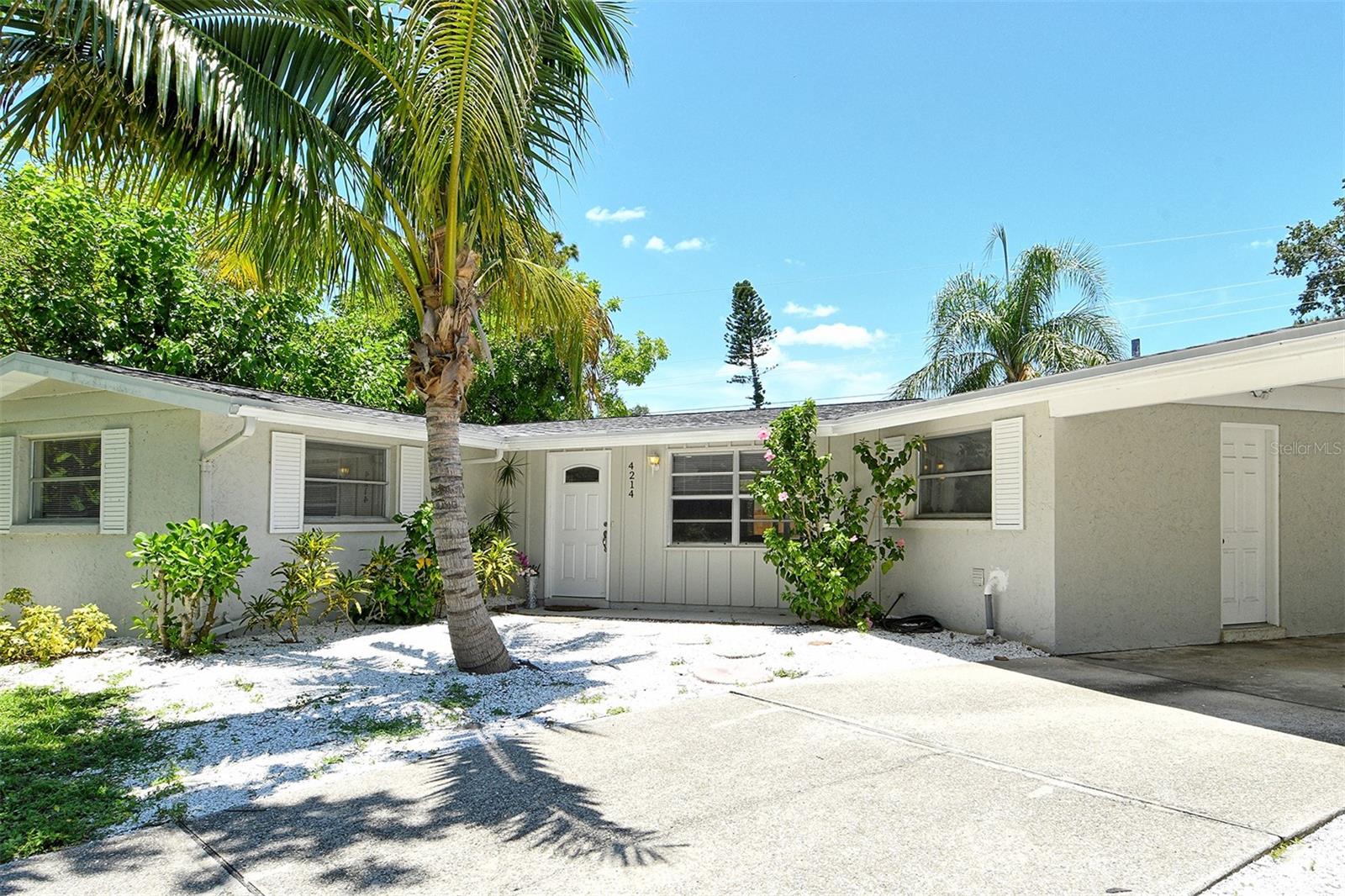 Welcome to 4214 Groveland Avenue a charming, move-in-ready home tucked away on a quiet street in the heart of Sarasota! This beautifully updated one-story residence features a new roof, re-lined plumbing, and upgraded 150-amp electrical service with EV readiness, offering peace of mind and modern convenience. Step inside to find an updated kitchen with granite countertops and stainless steel appliances, perfect for preparing your favorite meals. The living room is bright and airy, with abundant natural light and ceiling fans for year-round comfort. The well-proportioned primary bedroom with en-suite bath offers a cozy retreat at the end of the day. Enjoy Florida living on the spacious screened patio overlooking a large and low-mainenence shelled and fenced backyard with plenty of room for a garden or outdoor entertaining. Available furnished as well, making your move simple and stress-free, with a fantastic central Sarasota location close to shopping, dining, parks, and beaches. Don't miss this opportunity to own a well-maintained and upgraded home in one of Sarasota's most convenient locations!