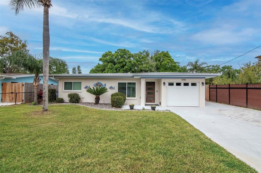 Rare Dunedin opportunity — beautifully updated 3-bedroom, 2-bath, 1-car garage home backing directly to the Pinellas Trail and located within the city’s golf cart zone just 1.5 miles from vibrant Downtown Dunedin. Bike the Pinellas Trail from your backyard, hop in your golf cart for dinner downtown, or enjoy Dunedin’s waterfront parks, breweries, restaurants, and year-round community events just minutes away. The owner has invested significant time and care into thoughtfully updating the home with a focus on quality, durability, and long-term value. The property has been carefully improved with attention to detail. Major upgrades include a newer metal roof, new soffits and gutters, hurricane impact windows installed in 2022, updated electrical, new lighting, freshly painted and both bathrooms completely renovated. The kitchen has been completely refreshed with new cabinetry, quartz countertops, new appliances including a Bosch dishwasher, and updated finishes, creating a bright and functional space for cooking and entertaining. The home also features water-resistant flooring throughout with tile and concrete surfaces for durability and easy maintenance. Additional improvements include replacement of the original Orangeburg plumbing and permitted improvements including the roof and enclosed back porch roof. The AC compressor and electrical panel have been relocated to a higher elevation, providing added protection and peace of mind. Step outside to a fully fenced backyard that backs directly to the Pinellas Trail, creating a perfect space to relax or entertain. The yard features low-maintenance landscaping with rock beds and barriers, a brick paver fire pit area, and double driveway parking in addition to the one-car garage. The driveway and garage surfaces have also been freshly sealed. The spacious backyard offers plenty of room to add a pool in the future if desired. The enclosed back porch adds additional living space and features a mini-split system providing both heating and cooling, allowing the area to be enjoyed year-round. A professionally painted mural on the exterior porch reflects the artistic character and charm of Dunedin, creating a unique and inviting space. Beautiful mature oak trees have been professionally trimmed and are in excellent condition, providing shade and character to the property. With direct trail access and close proximity to Downtown Dunedin, Honeymoon Island, and Caladesi Island, this home offers the perfect blend of outdoor lifestyle, convenience, and modern updates.