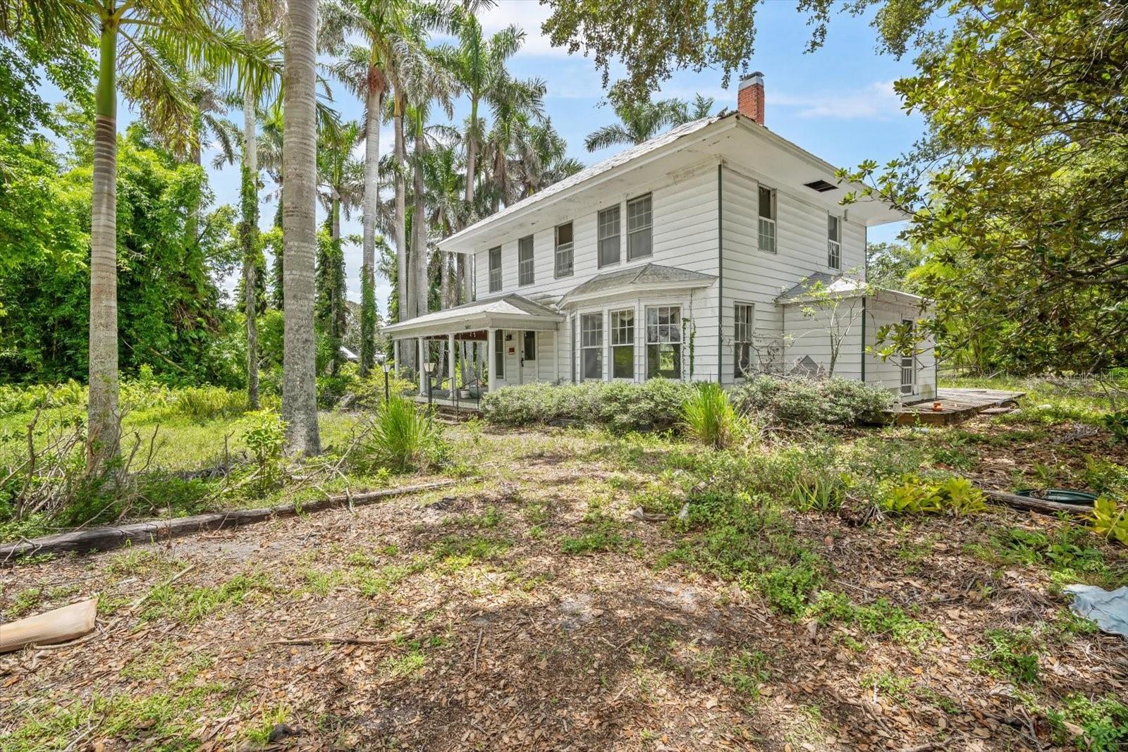 ~BUILD YOUR OWN DREAM ESTATE with this prime opportunity in the heart of West Bradenton's River District. Combine convenience with endless possibilities on this large .69-acre parcel. (currently 1.38-acre) Located on desirable Riverview Boulevard along the Manatee River this vast approx. 30,000 Sqft. lot (currently 60,000 Sqft.) has so much potential. Lush and lined with gorgeous mature trees and beautiful royal palms this property is rich in history and would make for an extraordinary family compound. Enjoy easy access to downtown, waterfront dining, and the stunning beaches of Anna Maria Island. Lewis Park is nearby, and St. Stephen's School is just a block away. Bring your vision to life. **Property is currently in the process of divided. This is for the WEST residence side which includes the home and garage with apartment in the back.
Please do not go onto the porch, deck or into the home. The value is in the property unless you have the desire to transform the home back to its original luster. Do not miss out on creating your perfect residence in this wonderful community!