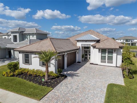 Photo of 33773 Ocean Spray Lane, Wesley Chapel, FL 33543 (MLS # TB8499098)