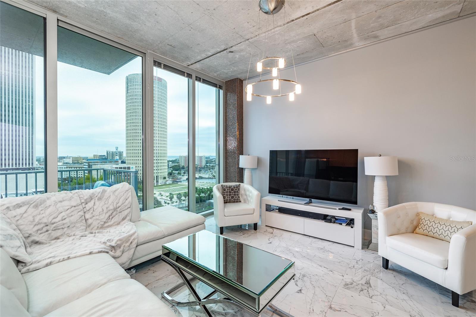 DOWNTOWN TAMPA! LIMITED SUPPLY, at SKYPOINT with the BEST SOUTH FACING VIEWS in the building ! This RARE, FURNISHED condo is located on the 11th Floor with Soaring, Unobstructed Views of the Tampa Bay, Downtown Skyline, Hillsborough River, Curtis Hixon Park, and Glazers Museum. You will feel suspended in the sky with panoramic views through the floor-to-ceiling glass windows. This one bedroom, one bathroom condo has 772 sf of living space, a huge master bedroom that can easily fit a king bed, updated tile flooring, a MASSIVE walk-in closet with custom storage, a spacious balcony, and one assigned parking space with stainless steel appliances and granite countertops throughout. Building amenities include 24/7 concierge, controlled building access, spectacular pool deck and spa, landscaped terrace, club room with billiards, media room and state-of-the-art fitness room, with restaurants right below at street level in the buildings mixed use spaces. Contact us today to schedule your private showing before it's too late! NO PETS, NO SHORT TERM RENTALS, CORPORATE LEASING, SUBLEASING OR AIR BNB.