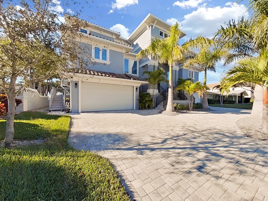 This immaculate home is located in one of the most sought after and exclusive streets in Harbor Bluffs.  As you enter the neighborhood over its private bridge, the first thing you will notice is the privacy that only an island can have.  Built on a slab with pillars, this house is a truly rare home from just that aspect.  The first floor is a garage fanatics dream with more than enough room for multiple cars, charging stations on both sides and a elevator that can take you to any floor.  Want an oasis?  Then your in luck! As you go to the back yard, you'll have to note the huge hot tub with its own drop down television for entertaining. Want to swim, just a couple more feet and your in your own private heated salt water pool with a built in walking deck. Want to go out in the intercoastal, then jump off the dock and your in the water. The kitchen is a "foodies" dream with high end appliances, a huge middle island, a huge pantry, and who wouldn't want to have a water view while you cook?  Walking through the house on the true hardwood floors is another amenity that makes this house a true diamond that you will be hard pressed to find in other newer homes.  Two master bedrooms make it easy to entertain, and bedrooms spread out on multiple floors will give everyone their own privacy. Boasting multiple a/c units/multiple zones with uv light package, gas appliances, on demand hot water, a Generac generator, voice controlled black out power shades across the back of the home, brand new exterior ceiling fans, this home is where you need to be.  Upgrades and refinement is what this house brings, its a must see for any buyer!