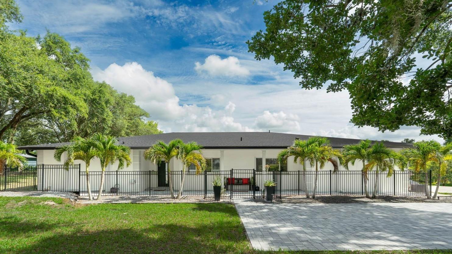 Rare Opportunity…1+ Acre…Courtyard Design… Fully Updated Pool Home. This distinctive U-shaped pool home features a 2000 sq/ft enclosed Atrium for exceptional outdoor living. Inside, every space is very large with Sliding Glass Doors creating a wall of glass for you to overlook the star of the show which is your sparkling 18x36 inground pool, private courtyard and a new outdoor kitchen. Almost everything has been upgraded and updated to make your move-in easy. The Expansive kitchen has been completely remodeled since 2020 with Smart Appliances, 36" Induction Cooktop with Cattura Downdraft, Samsung Refrigerator with family hub and a hidden smoothie station built-in over freezer drawers to make healthy snacks at a moment’s notice. The Primary Suite is located in the west wing with an outstanding primary bath boasting an insta-hot shower system with dual programming, 2 shower heads and 1 handheld water wand… Bedroom two has an ensuite bath and is currently being used as an office… Bedrooms three and four are in the east wing of the home, all with remodeled baths. This home can easily become a multigenerational home or in-law, Plus the one acre is fantastic with plenty of parking, space for chickens, a dog run and outstanding privacy. The Roof was replaced in 2022, all hot water heaters and 2 AC units have all been replaced. Windermere-Gotha has a rural feel, well established with long term residents, yet just a few miles from popular shopping, dining, hospital and access to major roadways such as 408, 429, and the Turnpike. A 20-30 minute drive to Orlando International Airport, Disney, Universal Studios and only 15 minutes to downtown Orlando. If you have been searching for a ONE-OF-KIND pool home… The search is over.