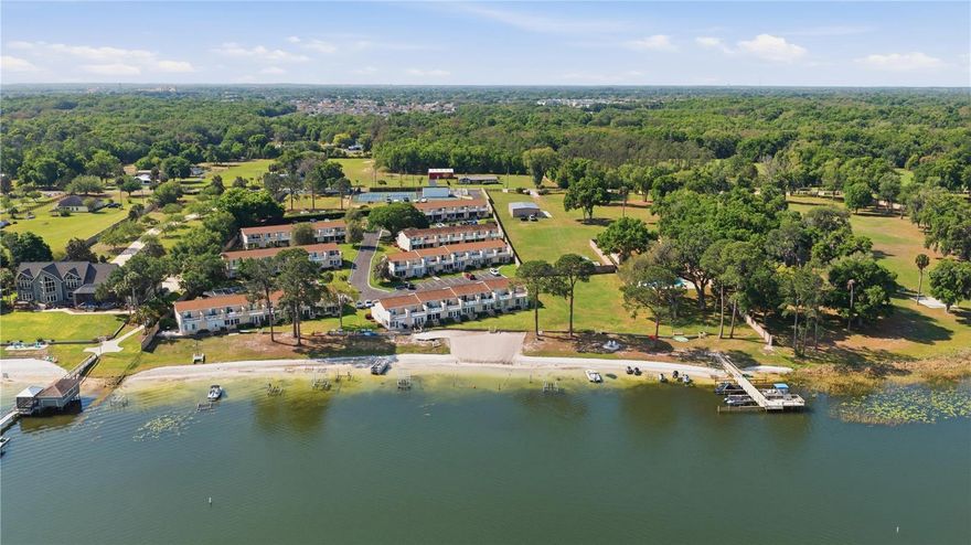 Virtually staged Photos: Seller said SELL! Condo with water views of Lake Weir in sought after Loch Harbor. This well maintained unit
offers 2 upstairs bedrooms, 1.5 baths, and a bright open layout. Enjoy sunset views from the enclosed Florida
room or the private balcony off the primary bedroom. Updates include a newer hot water heater, renovated
upstairs bath, granite kitchen countertops, and fresh interior paint. Community amenities include a private
pool, beach and lake access, clubhouse, tennis and pickleball, racquetball, and volleyball. Exterior
maintenance, pest control, and trash are included for easy living. Conveniently located less than 20 minutes
from The Villages with access to dining, shopping, and entertainment.