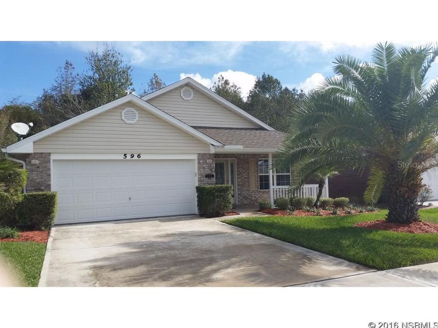 Beautiful brick 3 bedroom 2 bath 2 car garage home with over 1900 sq ft living area located in the Coral Trace Community. (A gated community with amenities that include a pool, work out room and club house) The home boasts new tile throughout, stainless steel appliances, electric fireplace with remote and an interior laundry area. The screened patio backs up to conservation area. Lawn service is included in the monthly rental amount.