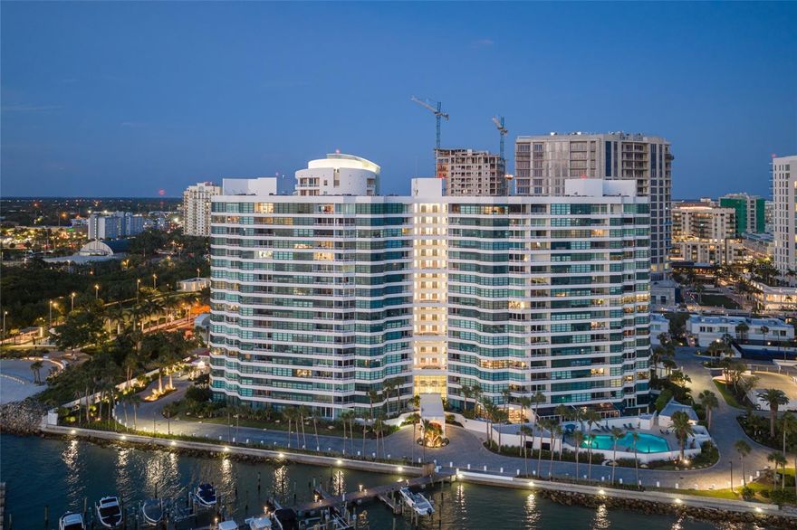 Mesmerizing, unobstructed views of Sarasota Bay and the Gulf of Mexico set a breathtaking stage from this towering 17th floor residence at Condo on the Bay, where sky, water, and city lights create an ever-changing coastal panorama. Perfectly positioned on a private peninsula in the heart of Sarasota, this home captures elevated waterfront living with a rare sense of openness and tranquility. From sunrise reflections over the bay to golden sunsets across the Gulf, every moment is framed by water. Expansive windows and floor-to-ceiling glass sliders draw your eye outward, while a spacious covered balcony offers a front row seat to passing boats, seabirds, and Sarasota’s natural shoreline. Upon entry, the view takes center stage, complemented by a custom built in buffet with wine cooler as well as French oak plank flooring. The renovated kitchen features new stainless-steel appliances, updated fixtures, Campbell solid wood cabinetry, and striking Cambria quartz countertops that extend seamlessly along the full wall, creating a clean, modern statement. A pass-through design connects the kitchen to the dining and living areas, enhancing both light and flow, with additional built-in cabinetry providing generous storage. The living space is thoughtfully designed with a floating media cabinet, Samsung Frame TV, and Sonos sound bar included. In the primary suite, custom details continue with floating nightstands, a wood canopy bed, and a spacious walk-in closet with built-ins, while a wall of windows showcases sweeping views of the bay, Longboat Key, and the Gulf beyond. Both bathrooms have been fully updated with new cabinetry, tile, and countertops, and the guest bedroom features a oversized closet with custom built-ins. Tinted glass entry doors throughout the residence add a refined contemporary touch. Residents of Condo on the Bay enjoy a secure, gated environment with 24-hour concierge and security, along with amenities that include two resort style pools, tennis courts, two fitness rooms, social spaces, and a private marina with boat slips available for lease. Kayak launches, a fishing pier, and waterfront walking paths further enhance the coastal lifestyle. Located directly next to The Bay, Sarasota’s transformative 50-plus acre waterfront park, residents have immediate access to scenic trails, performance venues, open green space, and year-round cultural programming. Downtown Sarasota’s renowned dining, arts, and cultural scene is just moments away, along with St Armands Circle and the white sand beaches of Lido Key. Whether as a full-time residence or seasonal retreat, this is a rare opportunity to own a premier position in Sarasota’s skyline, offering panoramic water views, exceptional amenities, and unmatched proximity to downtown coastal living. Furnishing are available on a separate schedule.