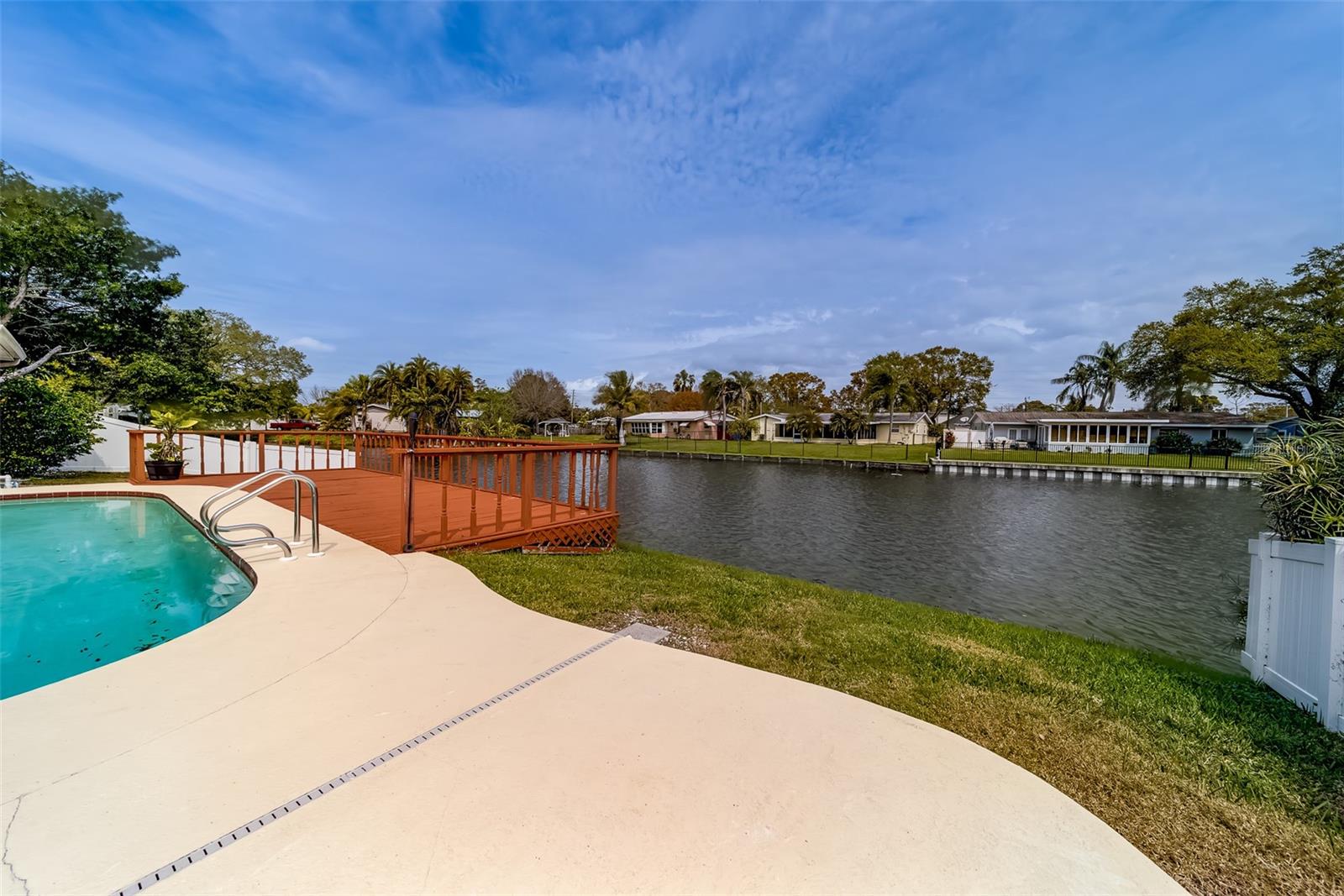 Seminole Location. This 3 bedroom 2 bath pool home is very spacious, light and bright. Kitchen and baths have been updated with newer cabinets, granite, stainless appliances, vanities and more. Newer laminate in the living area and bedrooms. Split floorplan. Washer and dryer in the updated garage with basin sink. Door opens to the pool with deck for entertaining and lake for relaxing and watching the wildlife. Good location. Seminole schools. Close to parks, restaurants, banks, shopping, and just minutes away from the Gulf Beaches! Rent includes pool and lawn maintenance.
